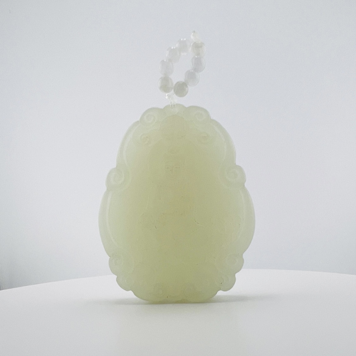 White jade Buddha pendant