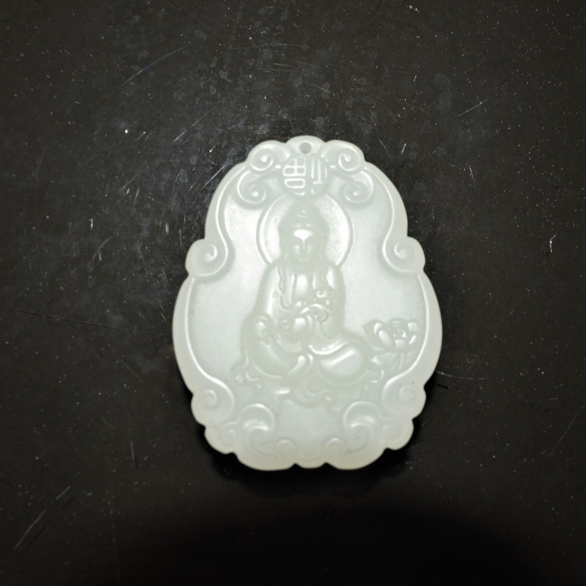 White jade Buddha pendant