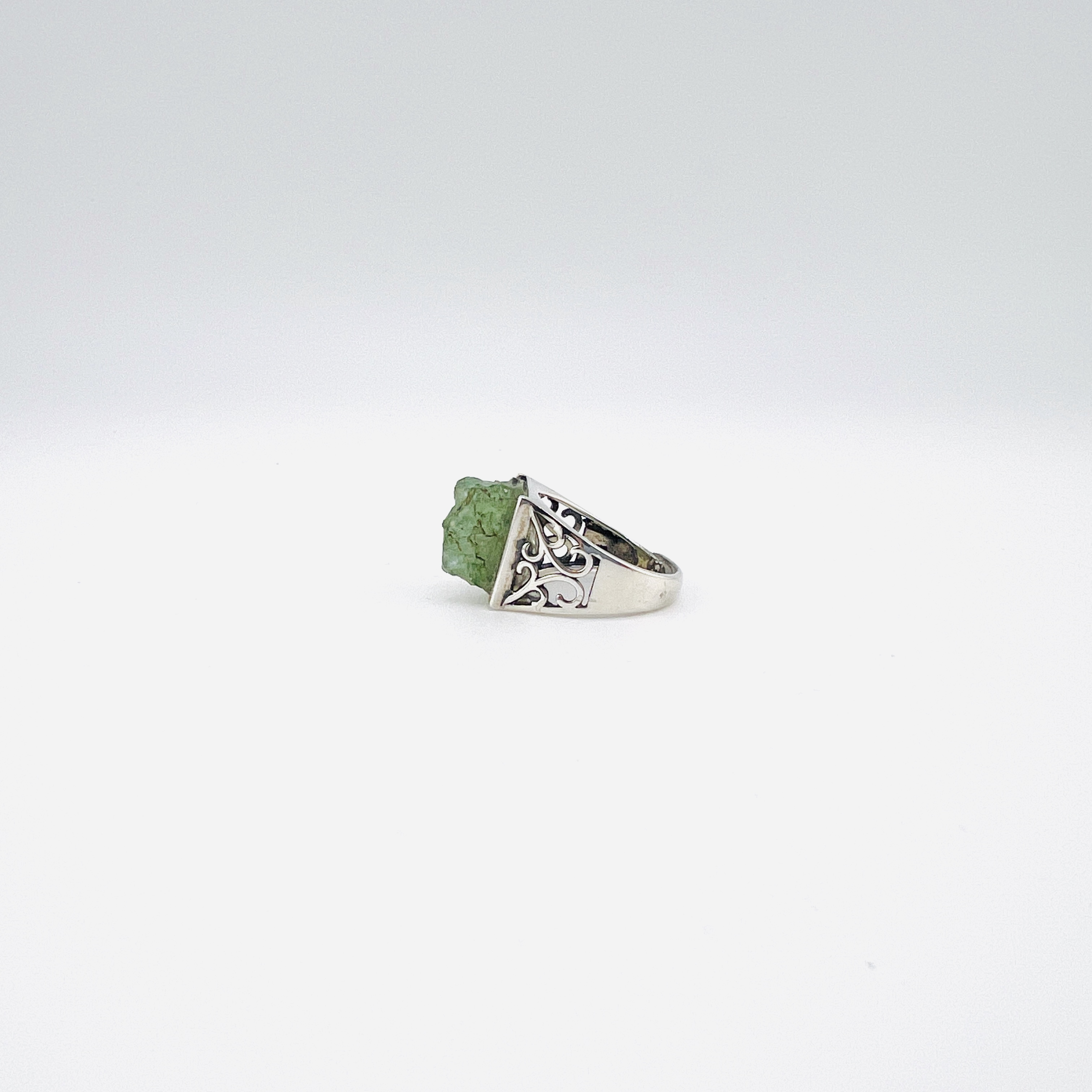 Raw green emerald cabochon and silver ring