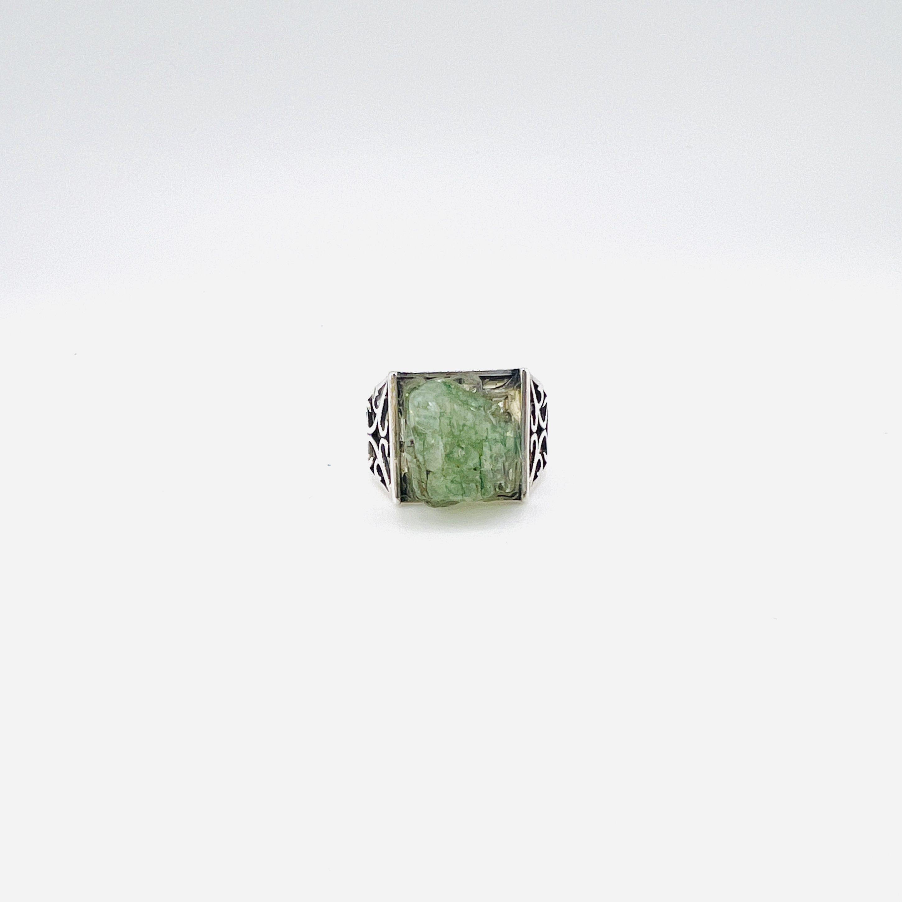 Raw green emerald cabochon and silver ring
