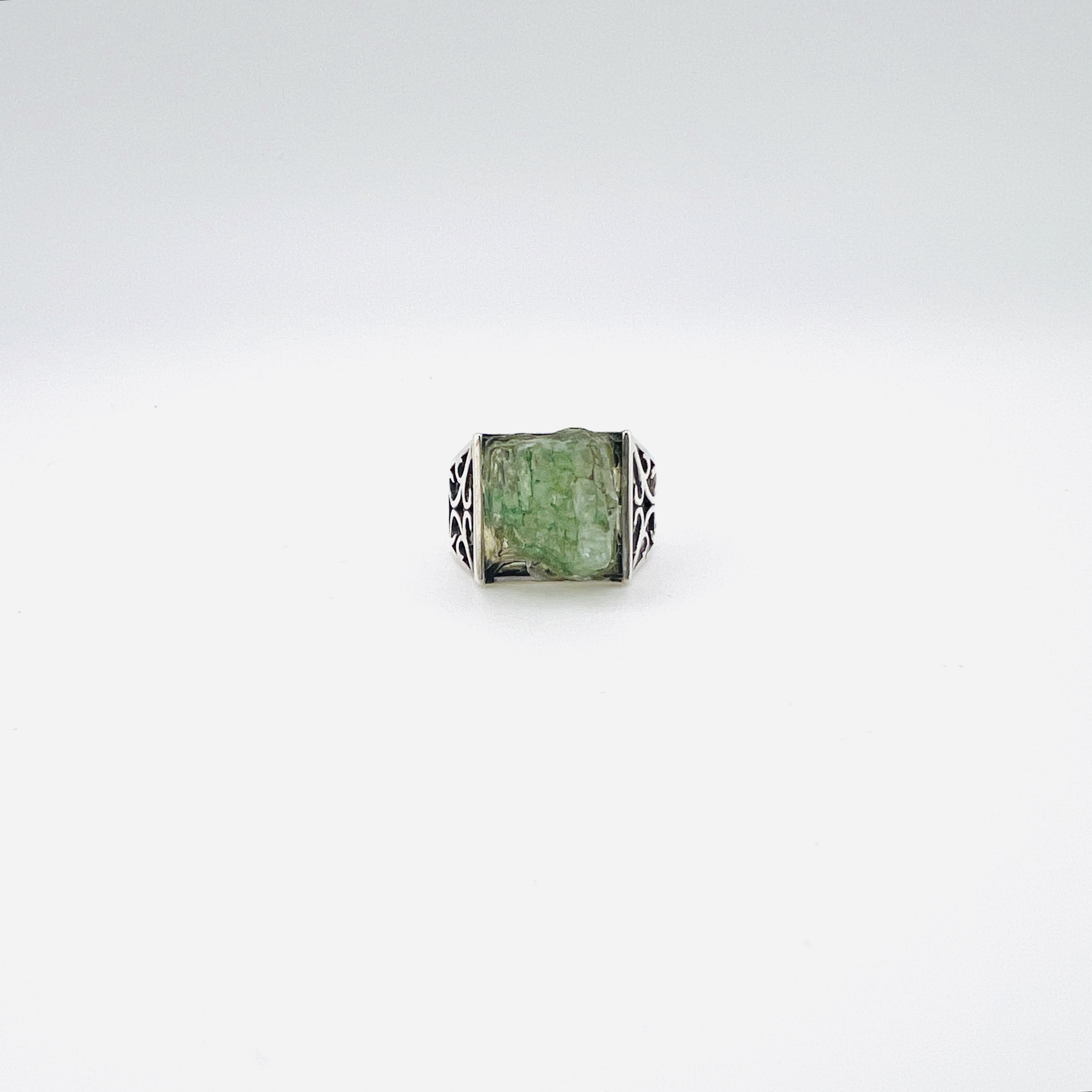 Raw green emerald cabochon and silver ring