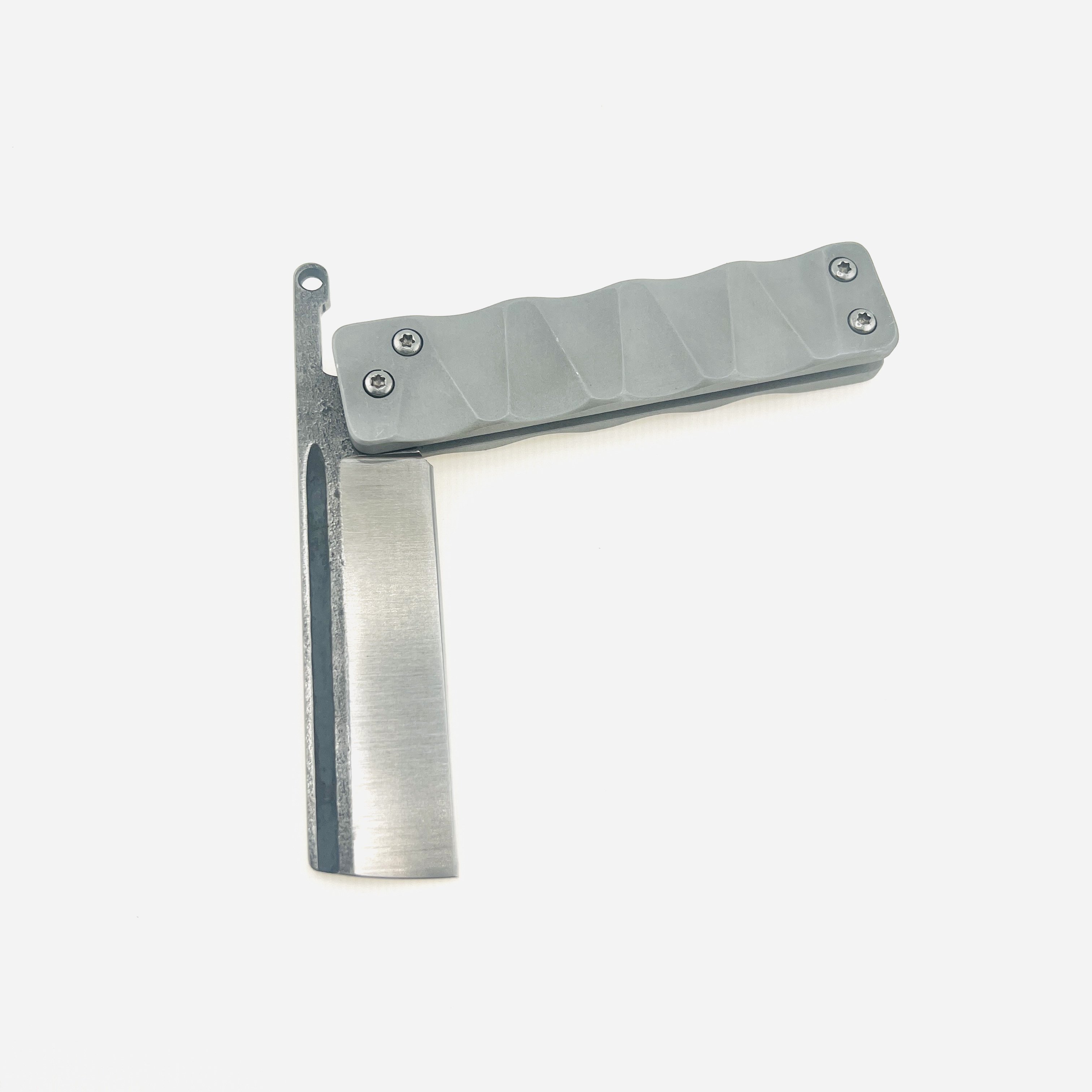 The Ruler flip razor in D2 steel and space aluminum