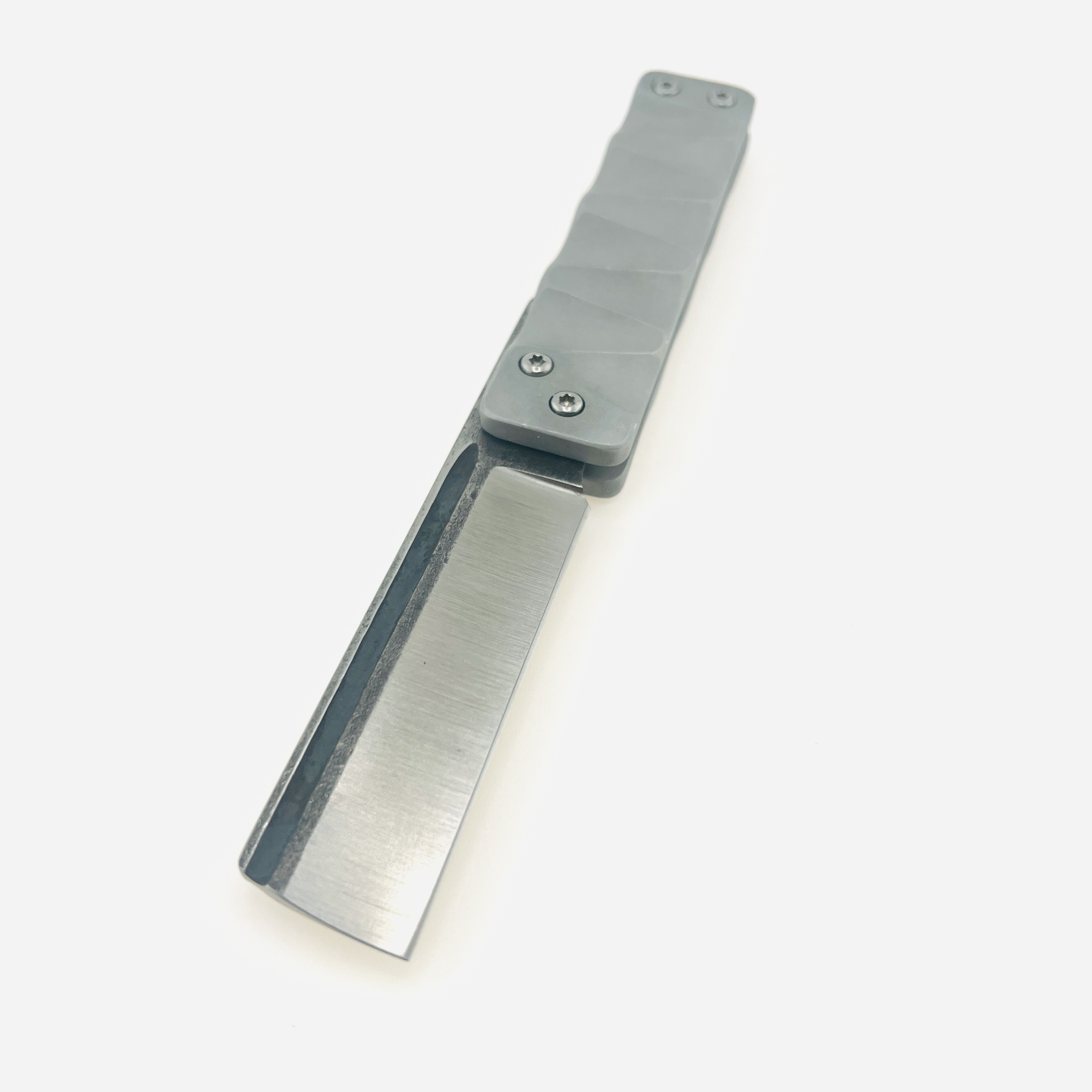 The Ruler flip razor in D2 steel and space aluminum