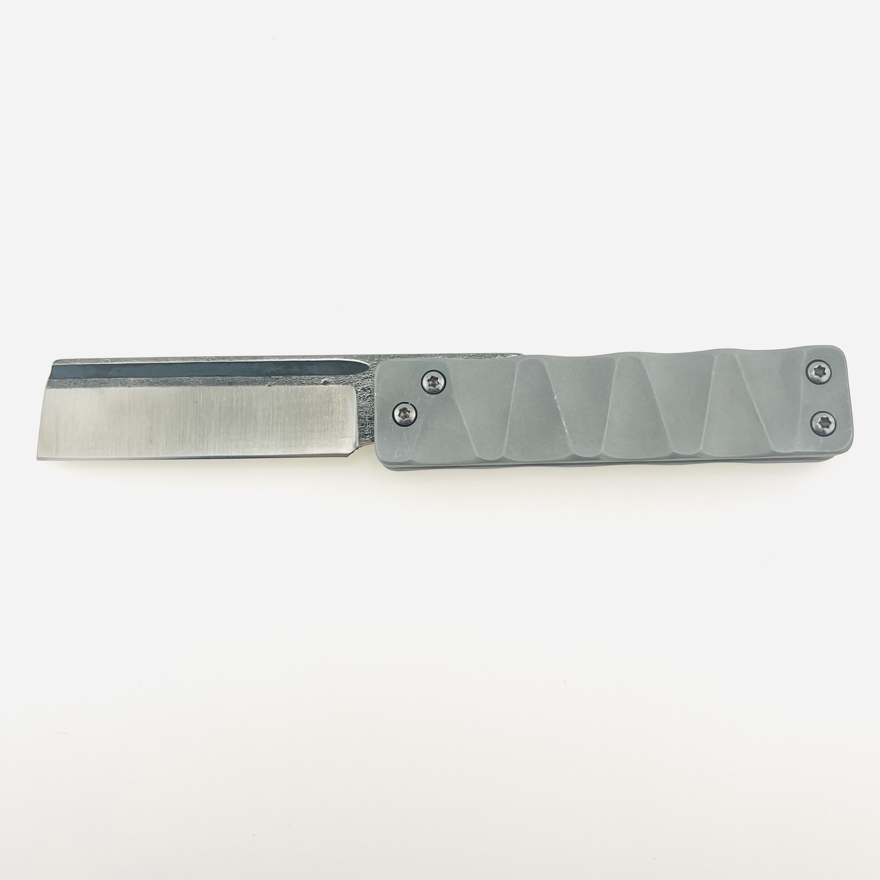 The Ruler flip razor in D2 steel and space aluminum