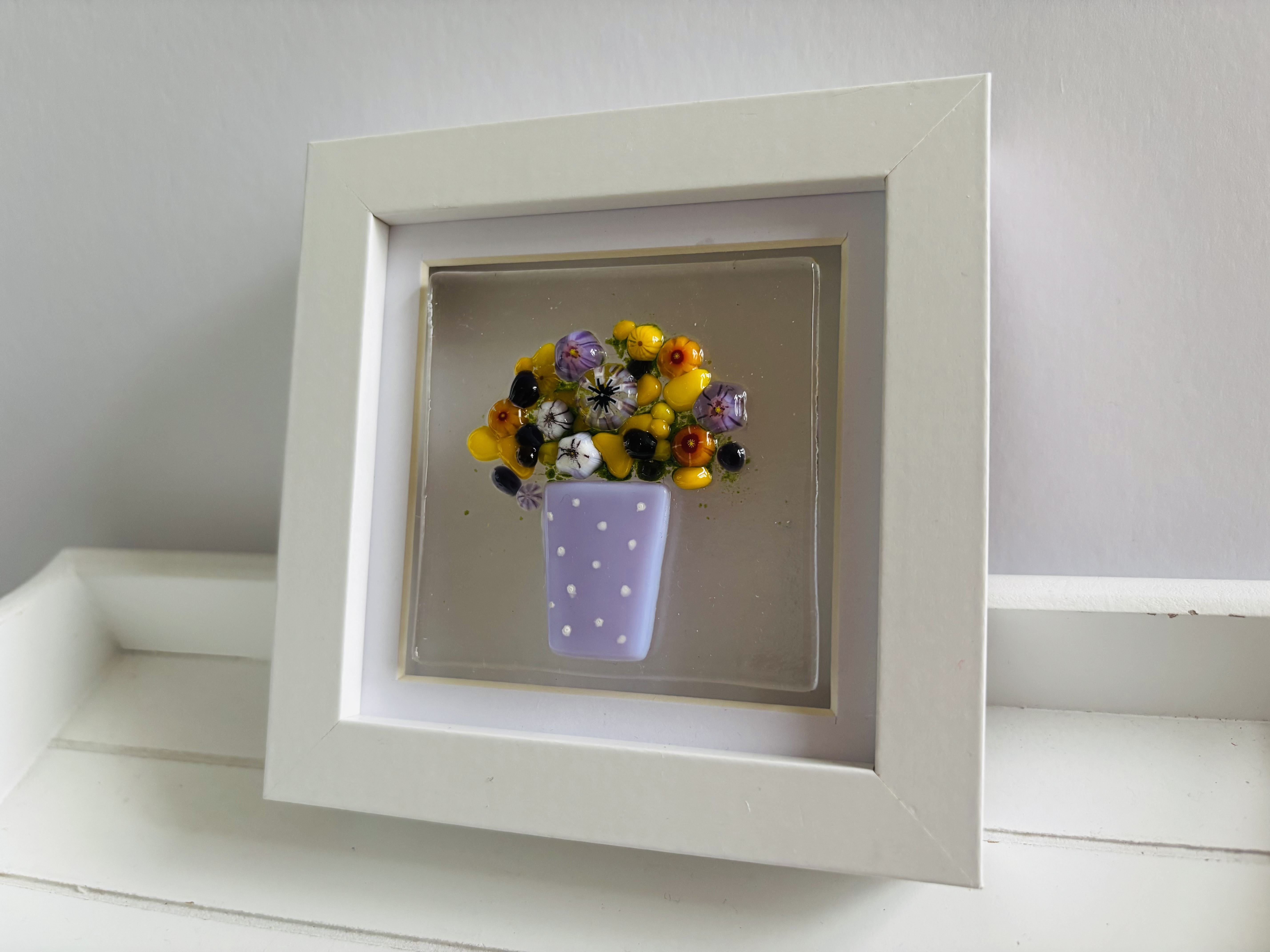 Lilac Vase with yellow and purple flowers