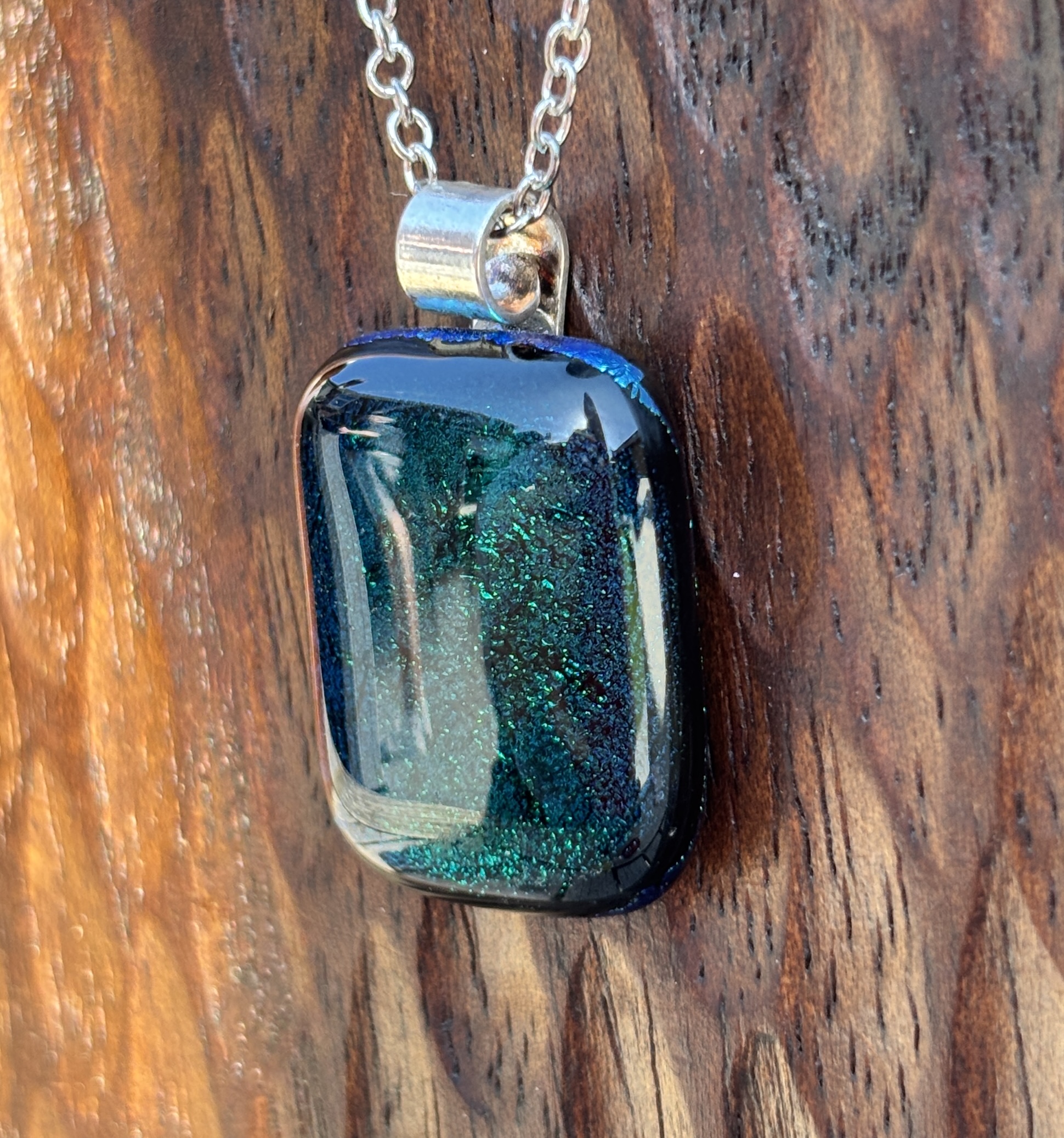 Dark green dichroic