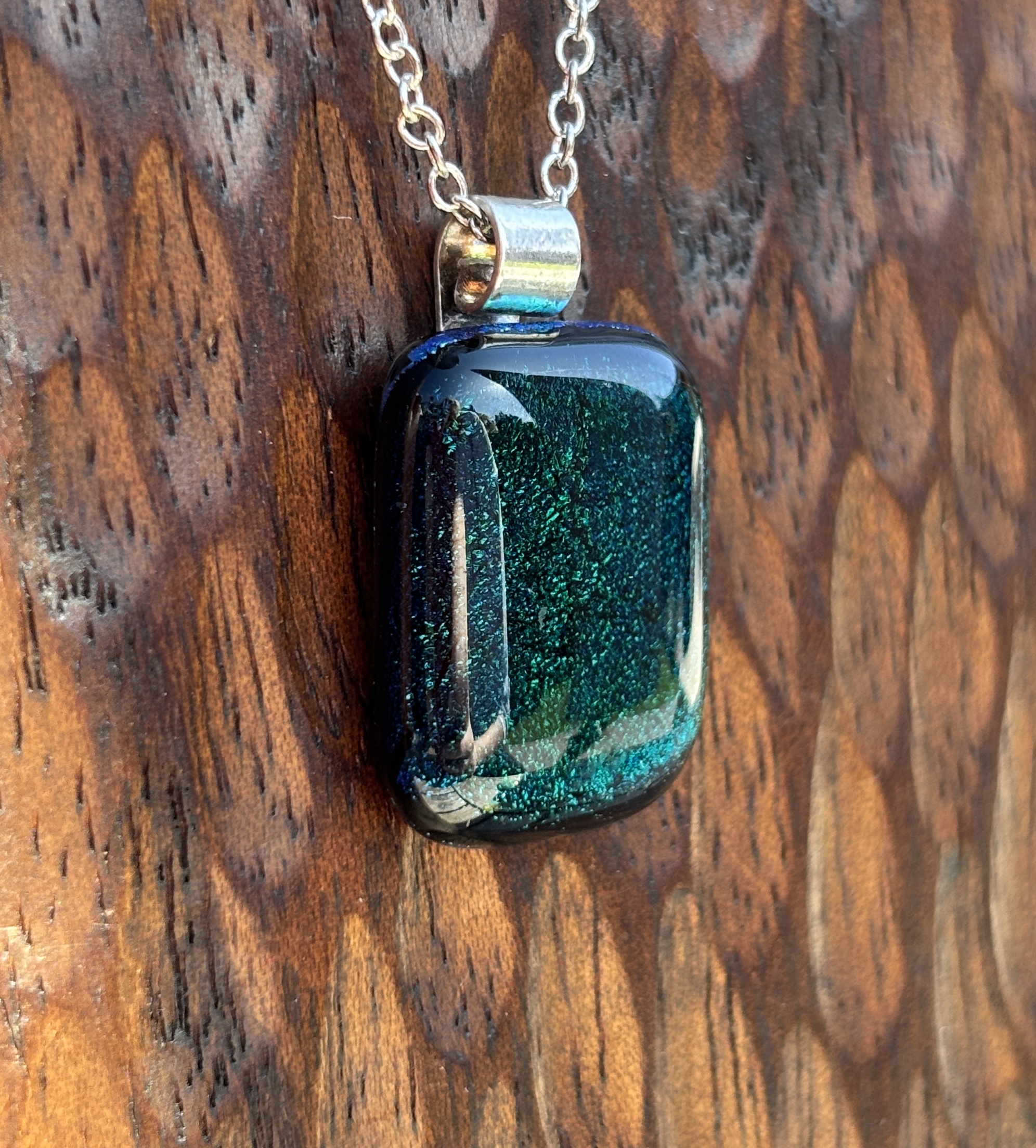 Dark green dichroic