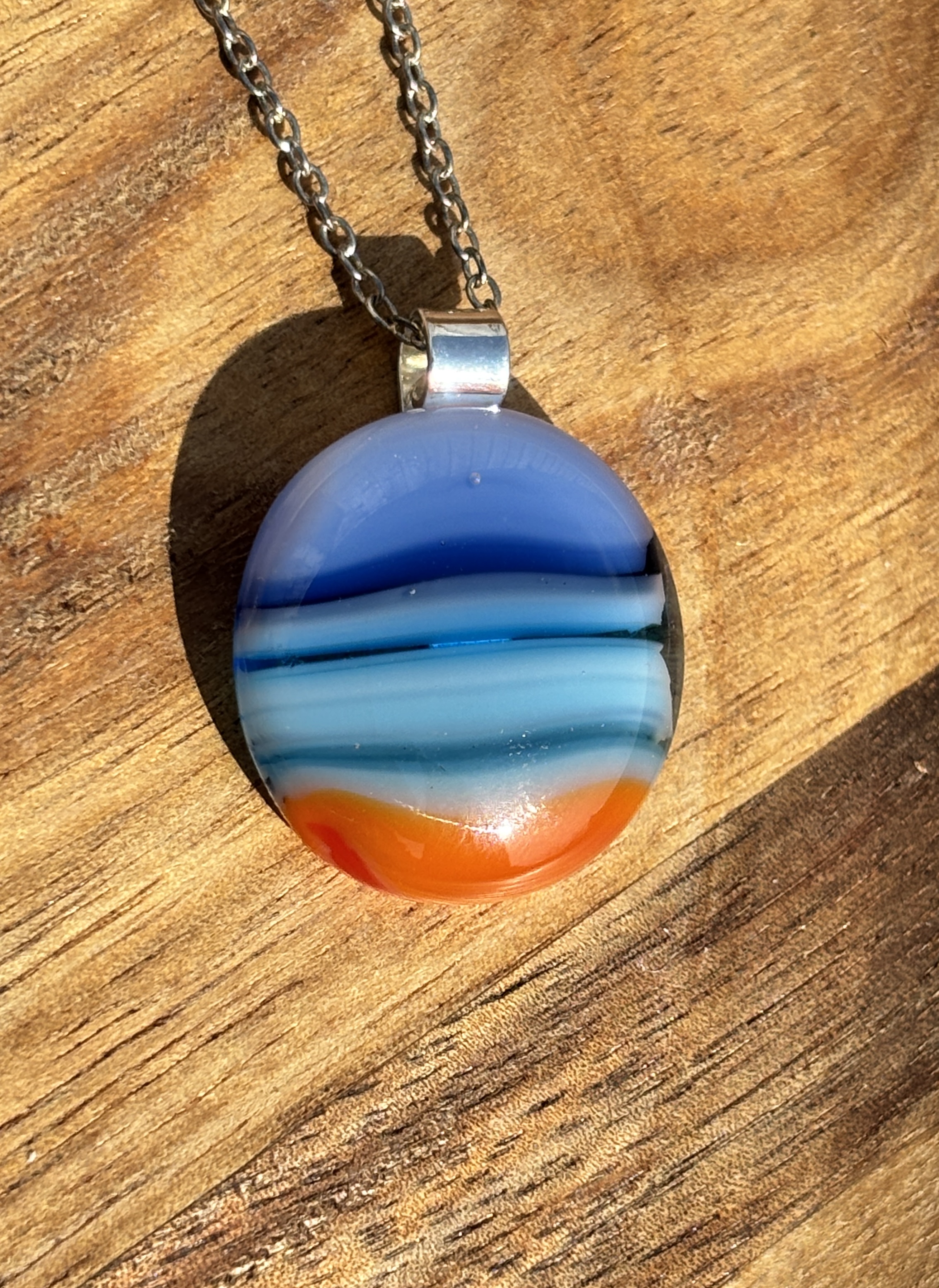 Blue and orange stripes with silver plated bail