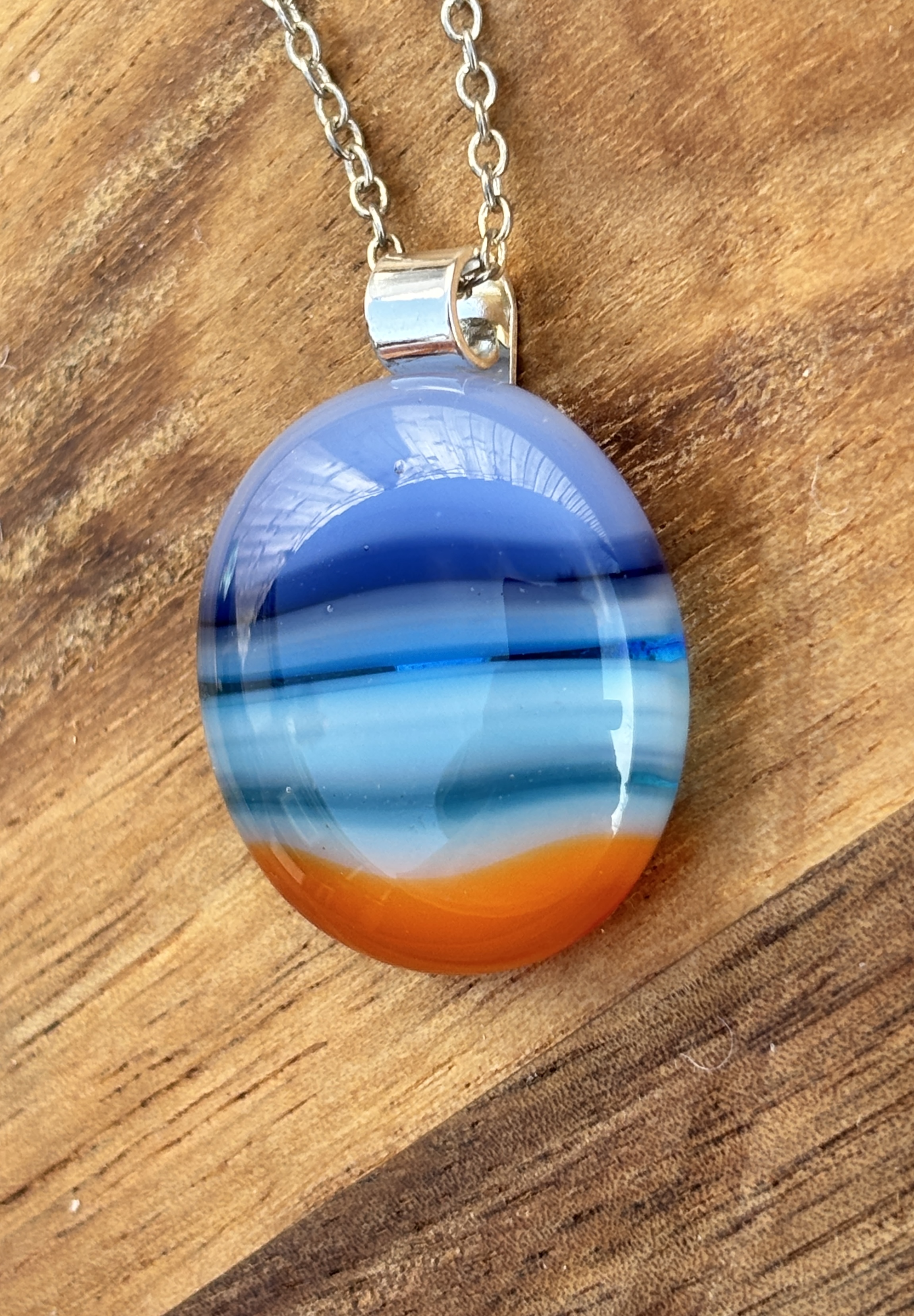 Blue and orange stripes with silver plated bail