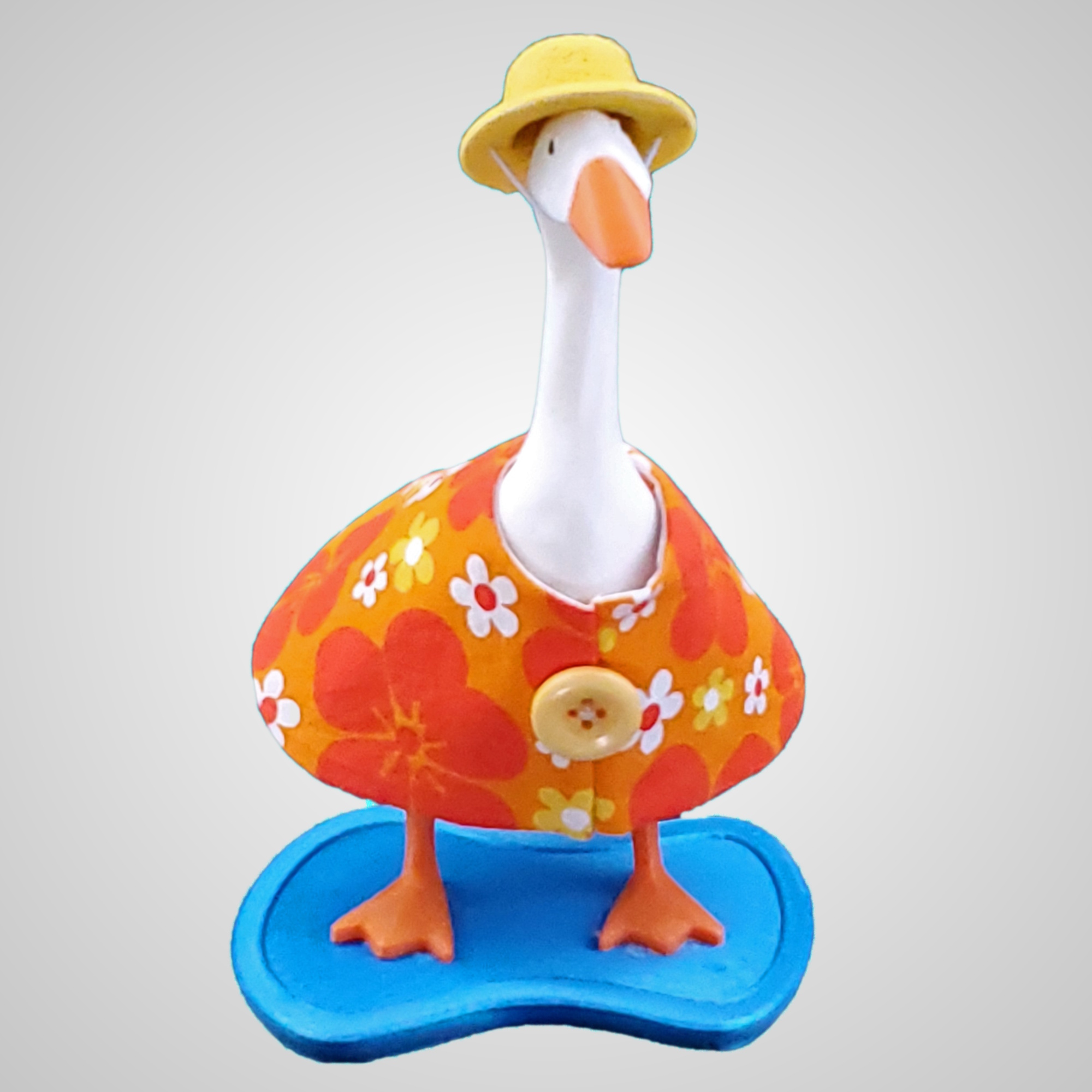 Orange and Yellow flowered desk goose dress with a felt hat.