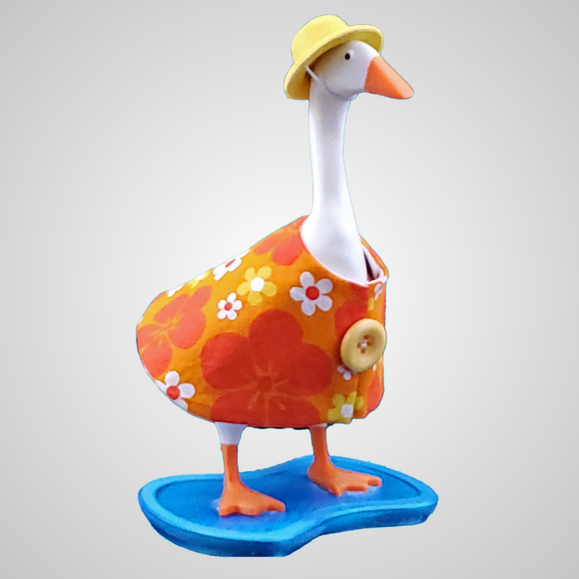 Orange and Yellow flowered desk goose dress with a felt hat.