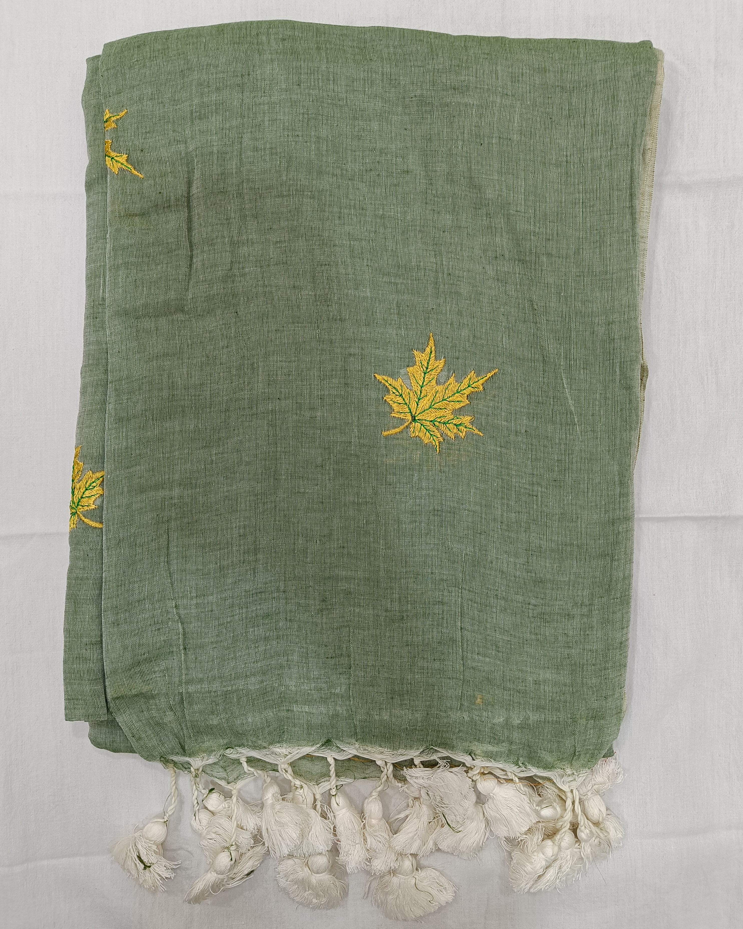 Pastel Green Saree With Yellow Maple Flowers Embroidered on Mulmul
