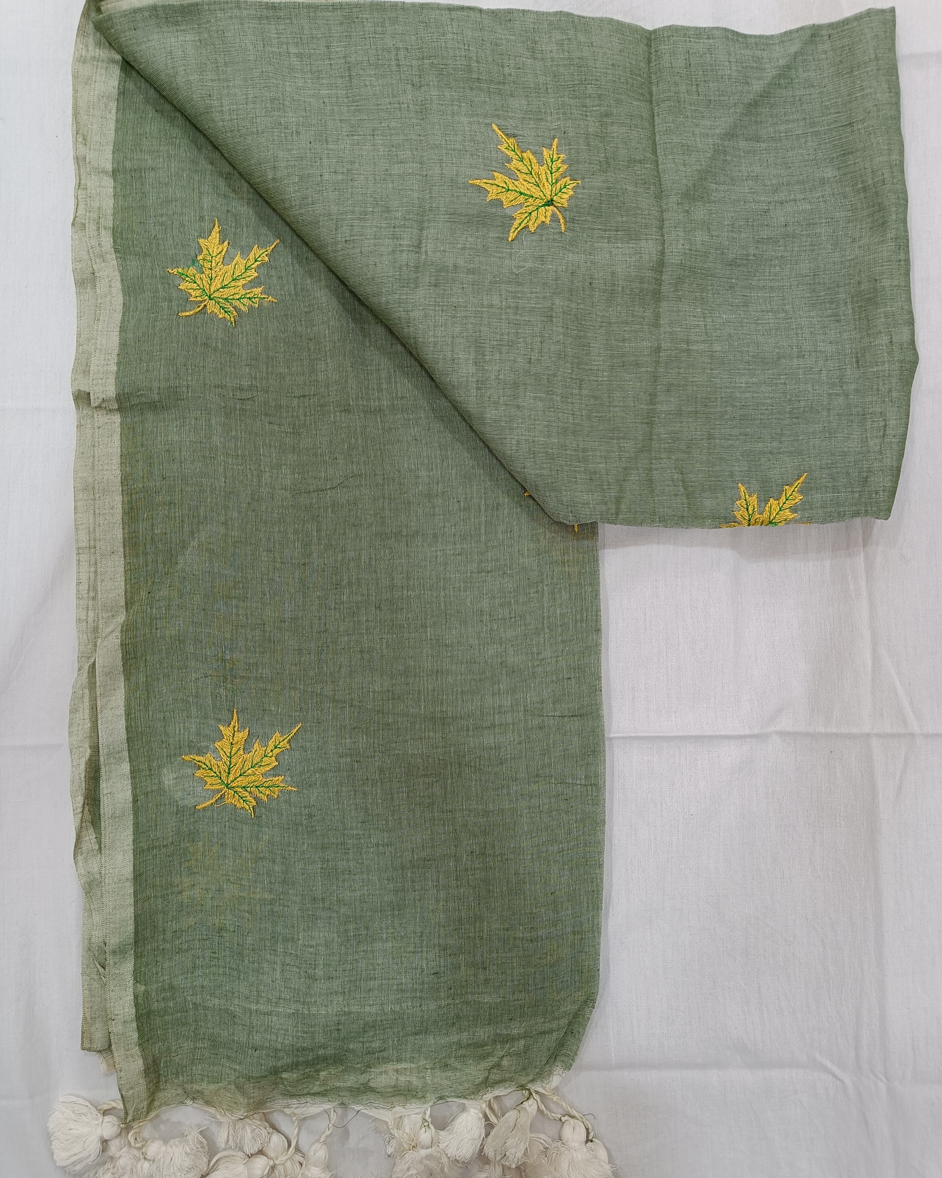 Pastel Green Saree With Yellow Maple Flowers Embroidered on Mulmul
