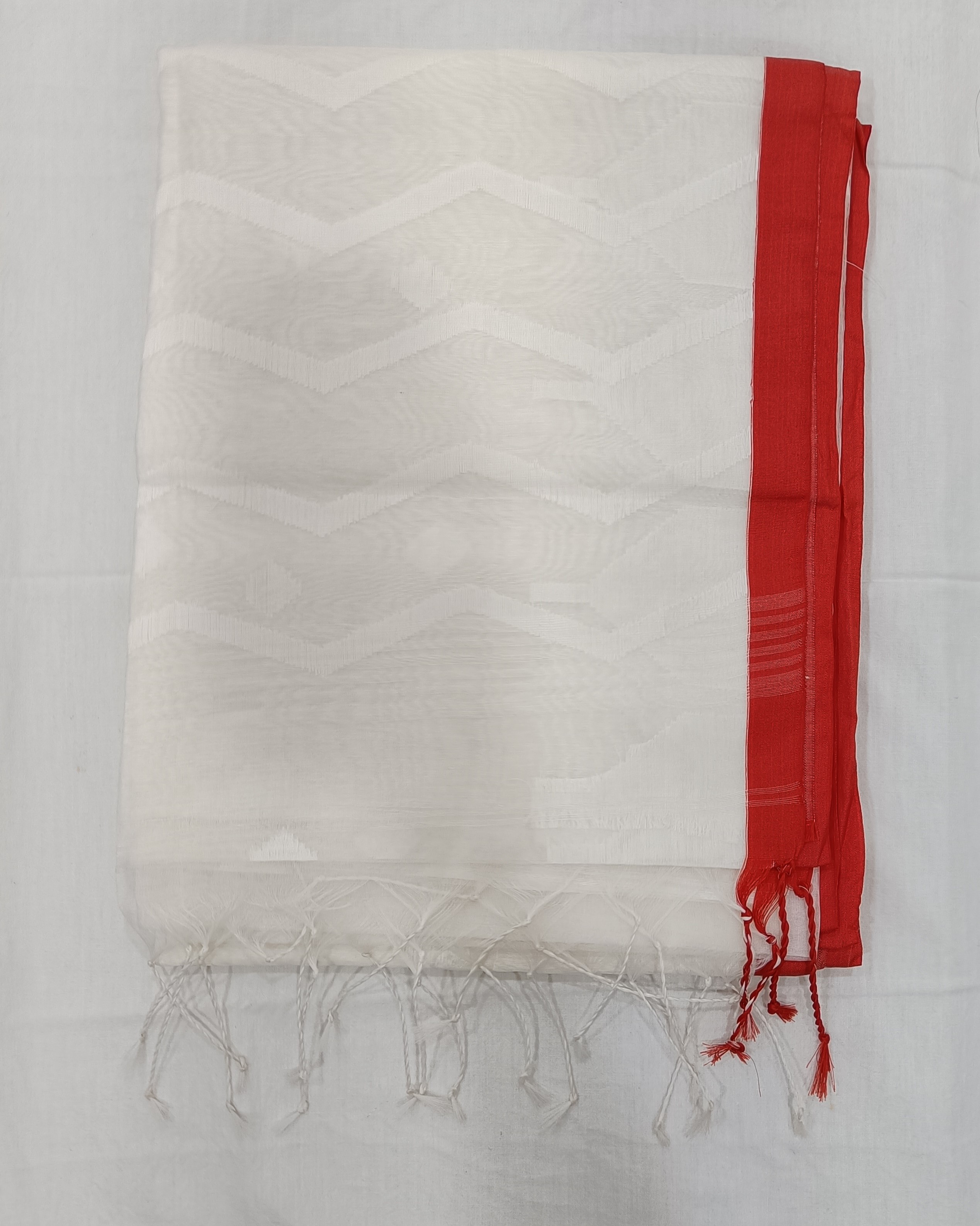 White Transparent Muslin Saree with Zig Zag Pattern on Pallu & Red Border