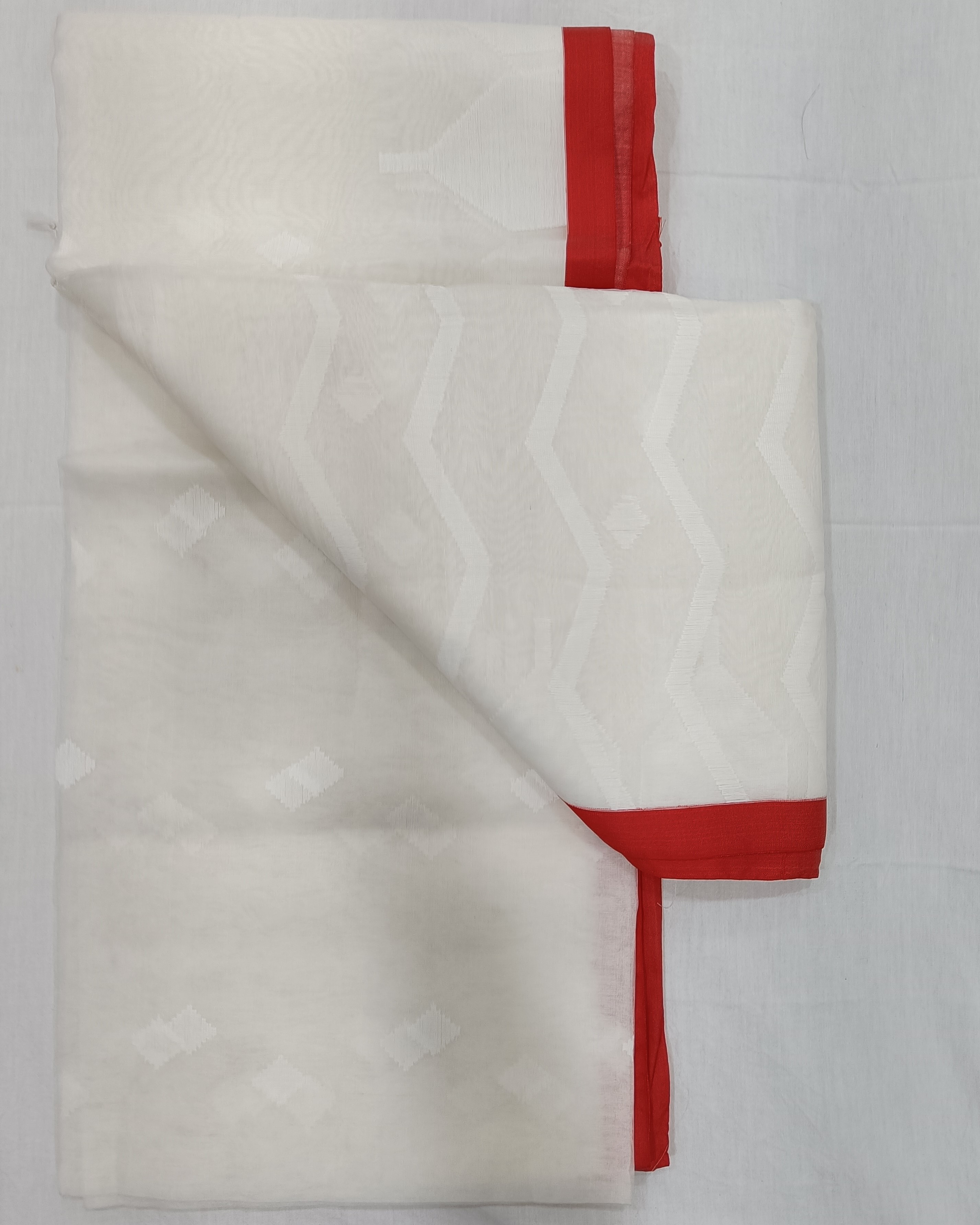 White Transparent Muslin Saree with Zig Zag Pattern on Pallu & Red Border