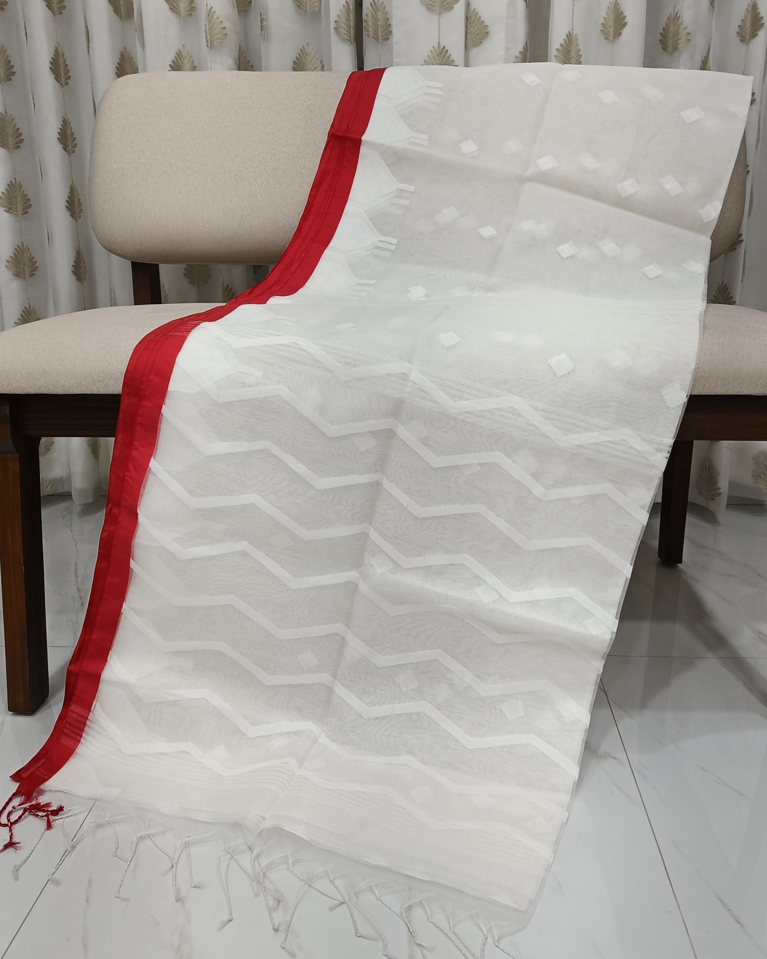 White Transparent Muslin Saree with Zig Zag Pattern on Pallu & Red Border