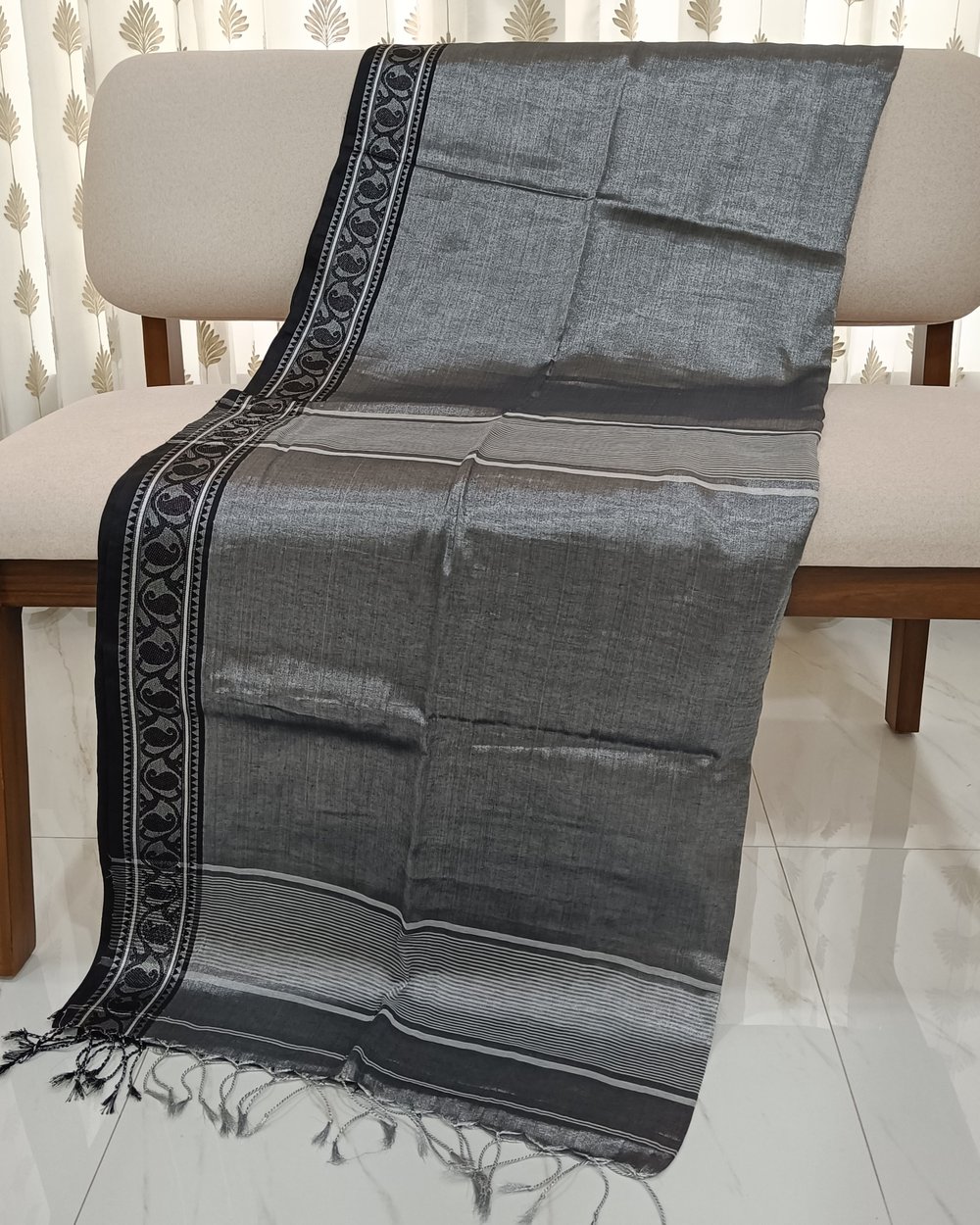 Grey Color Tissue Saree With Small Black and Silver Weaved Border