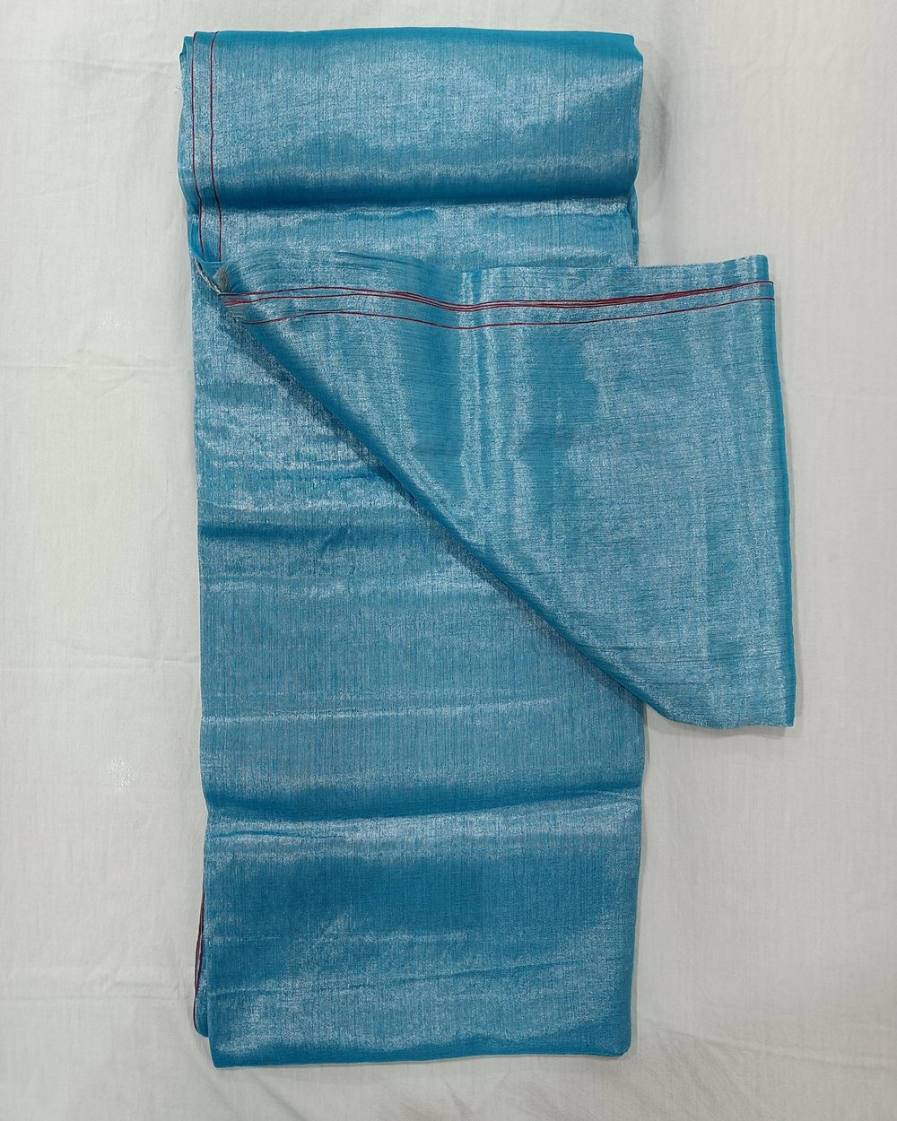 Sky Blue Pure Tissue Saree With Fine Red Border