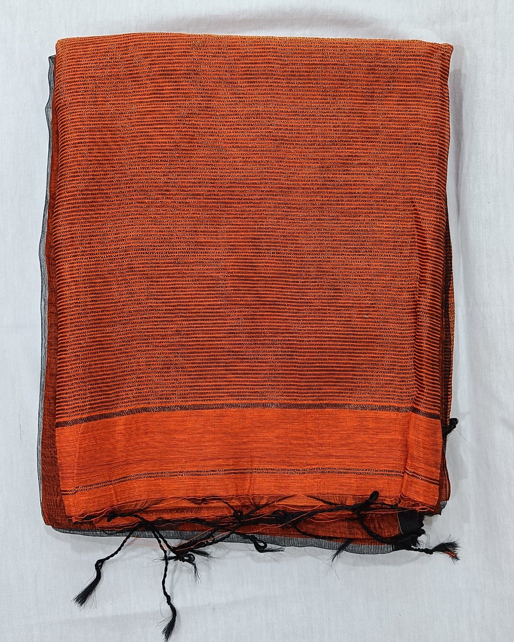 Orange Color Semi Muslin Saree With Handwoven Zari Butas 