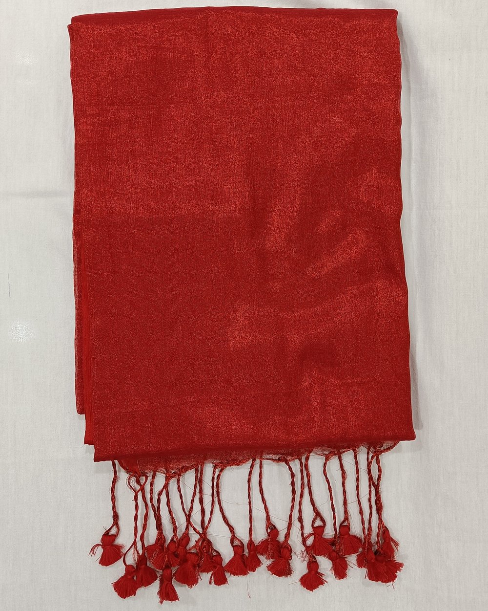 Red Color Tissue Saree With Tassels At Pallu.