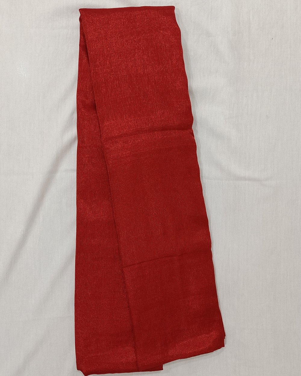 Red Color Tissue Saree With Tassels At Pallu.