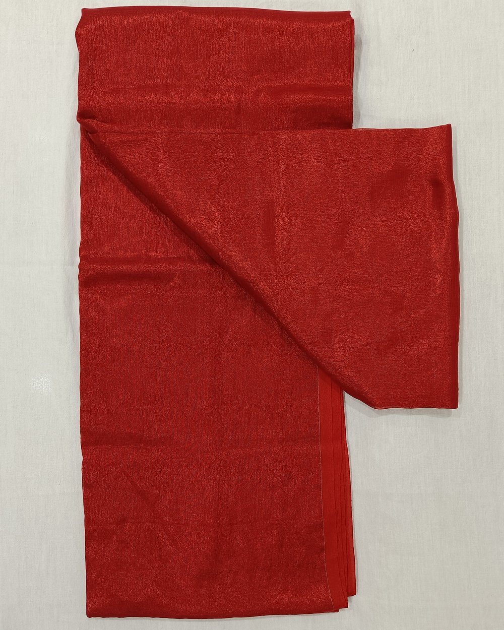 Red Color Tissue Saree With Tassels At Pallu.