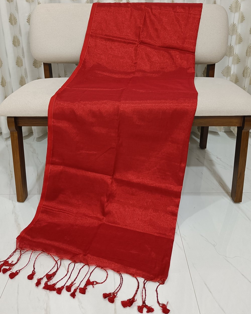 Red Color Tissue Saree With Tassels At Pallu.