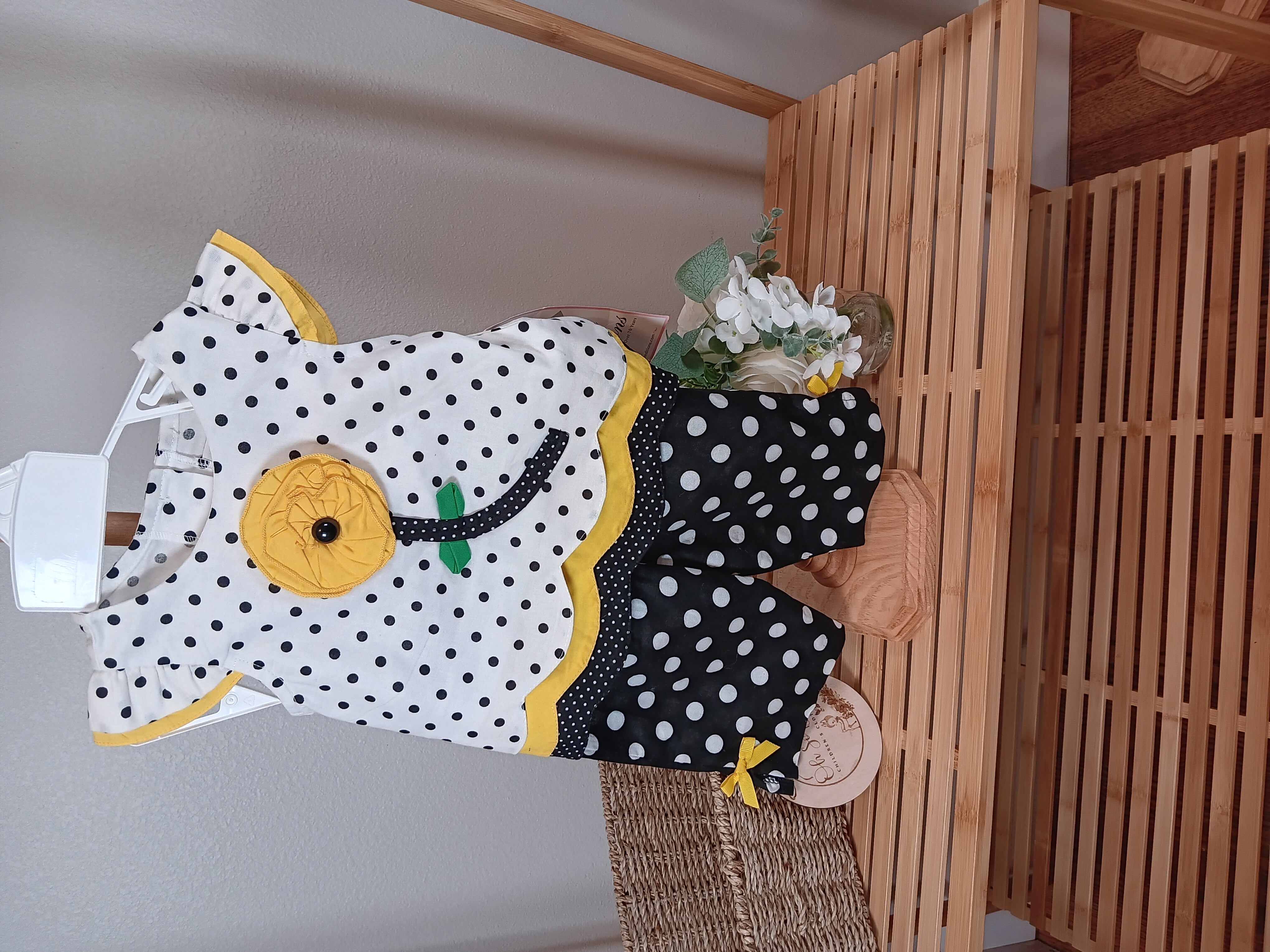 Rare Editions brand black and white polka dots outfit with yellow flower on front 12mo size