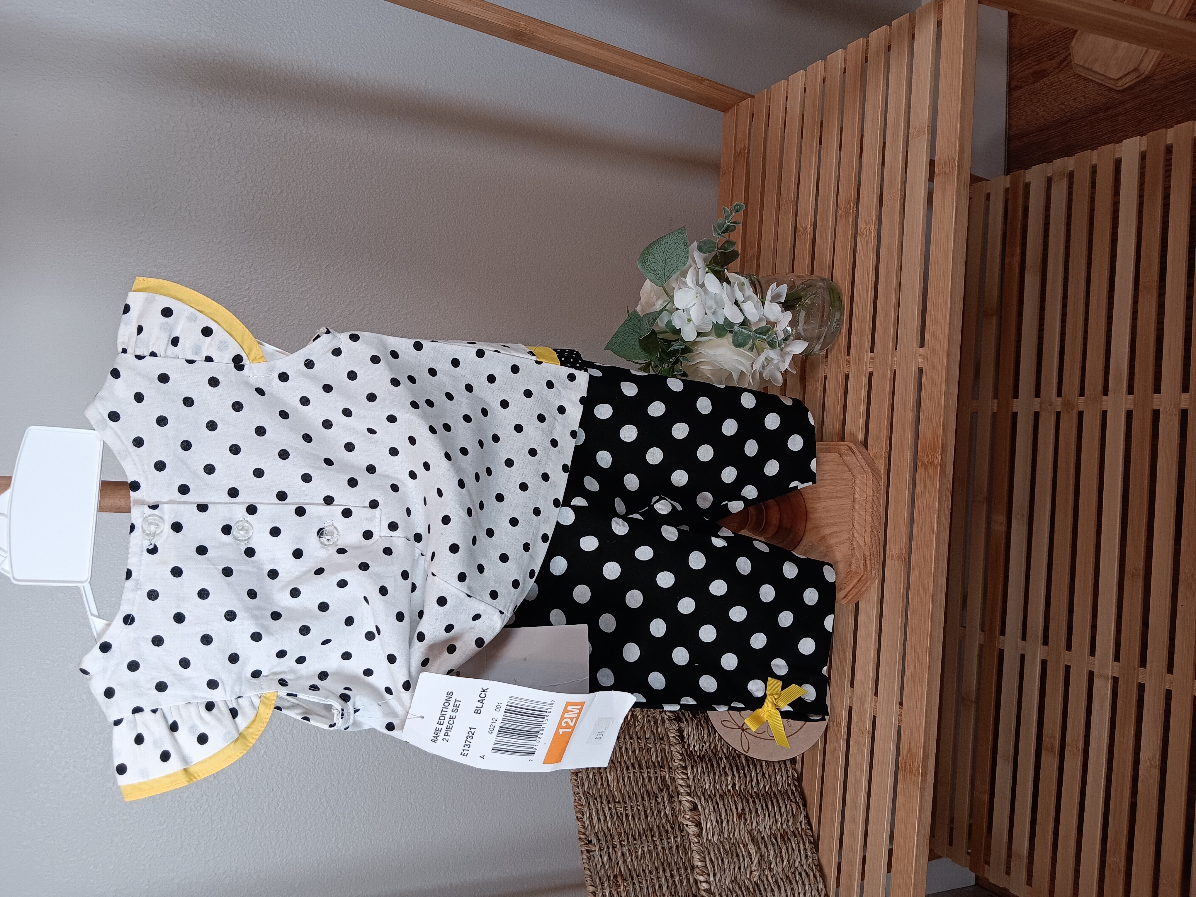Rare Editions brand black and white polka dots outfit with yellow flower on front 12mo size