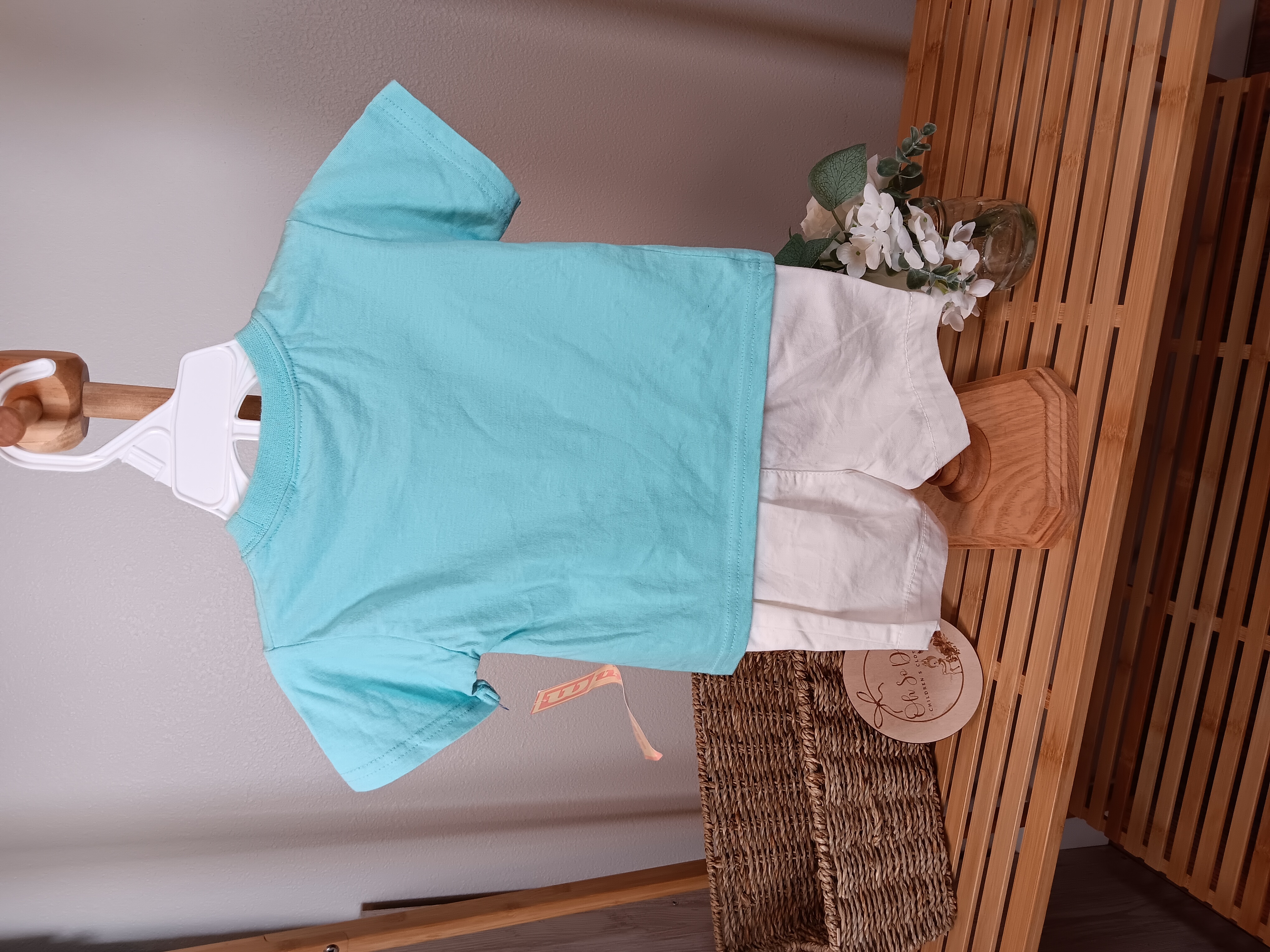 2 piece short set shirt by Wilson, shorts by Circo both 12 months FLAWED