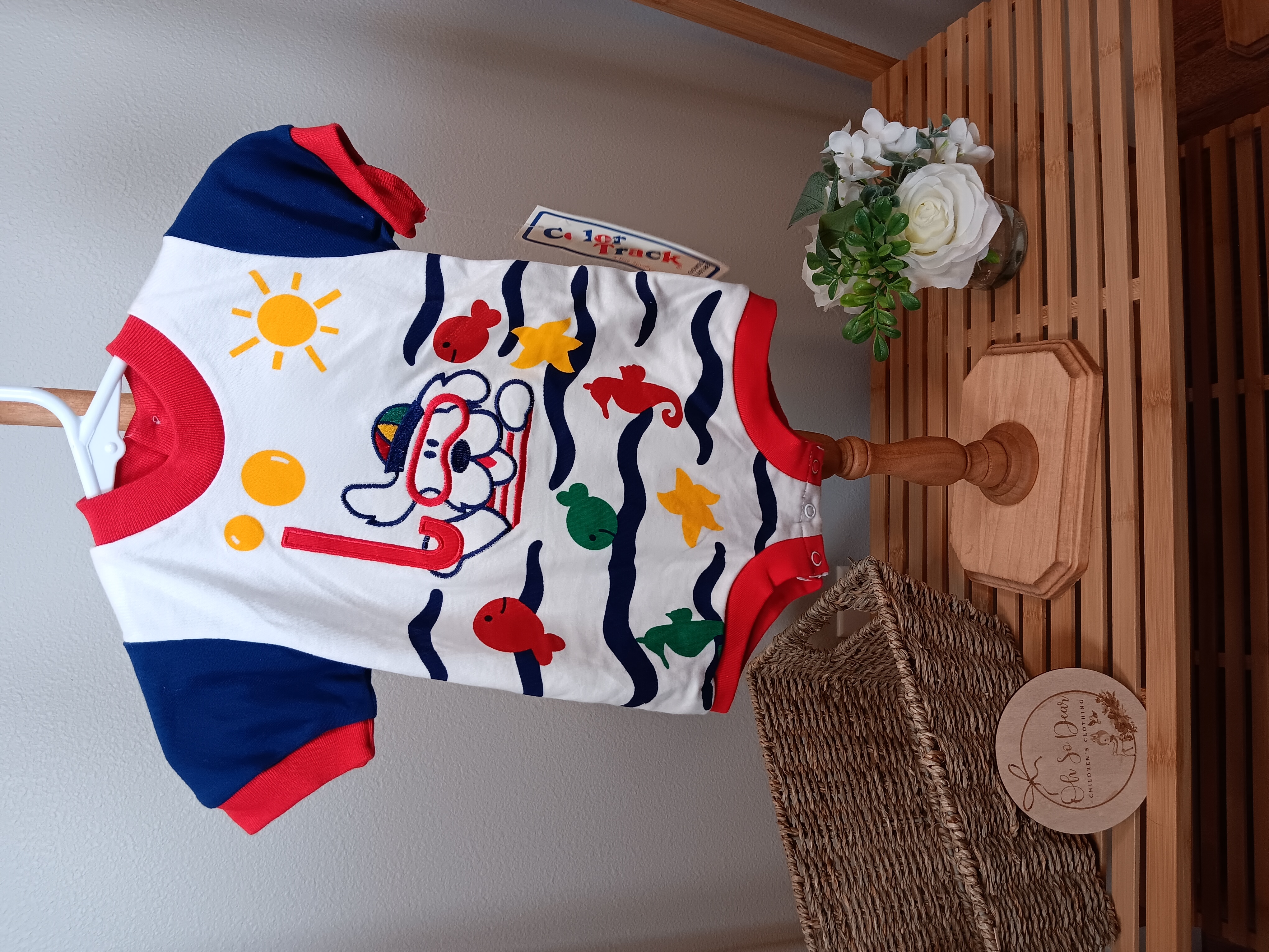 Color Tracks brand romper with doggy swimming on front smaller 6 to 9 months