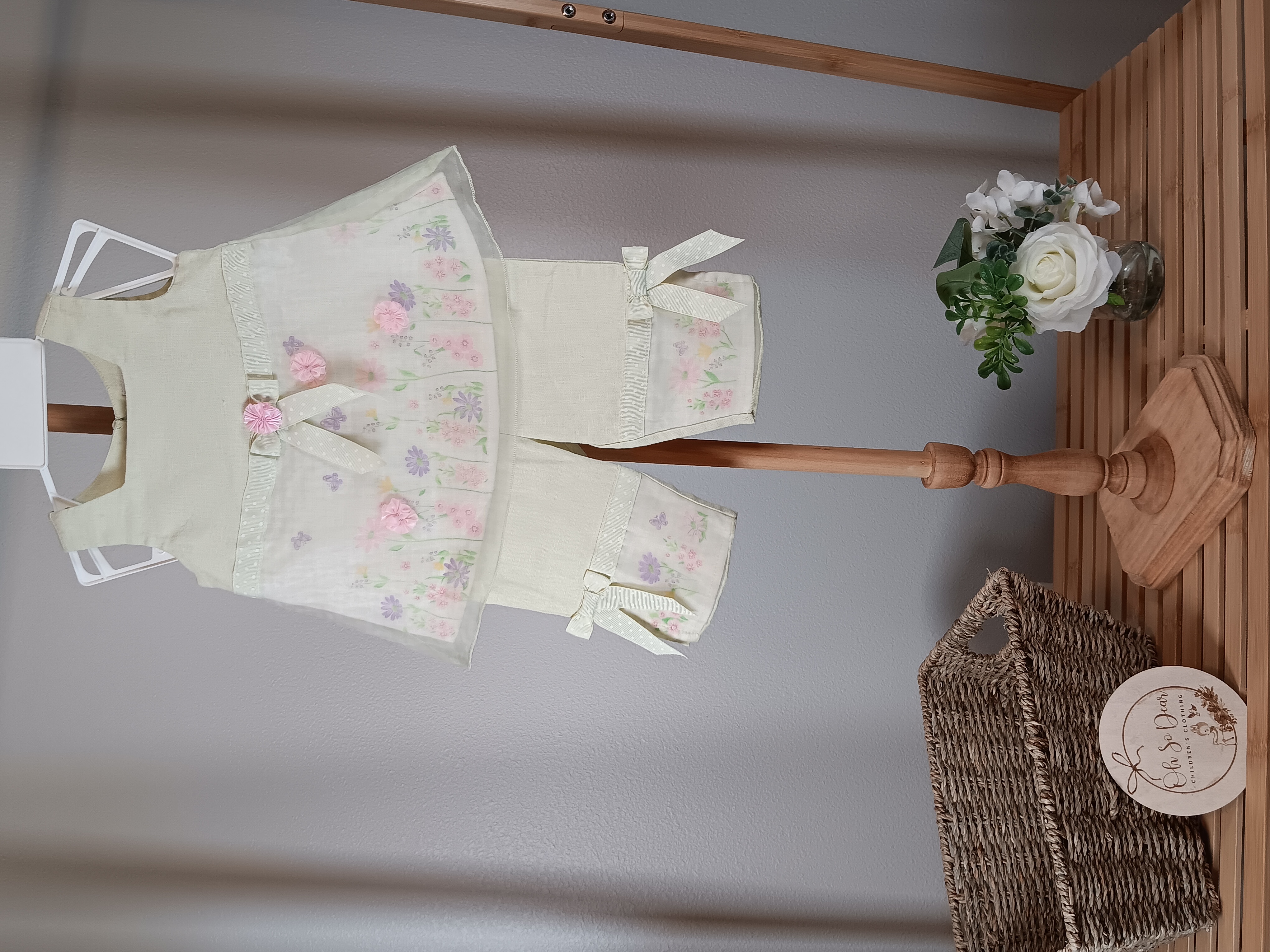 Sweet 2 piece outfit for the 3 to 6 months size baby girl mint green with pink ribbon rosettes.