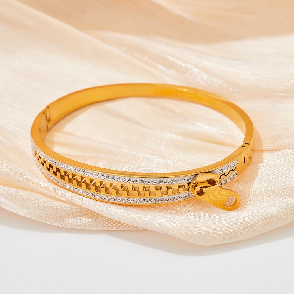 TEULRIP Gold Plated Stainless Steel Cubic Zirconia Studded Zip Hand Bracelet for Women
