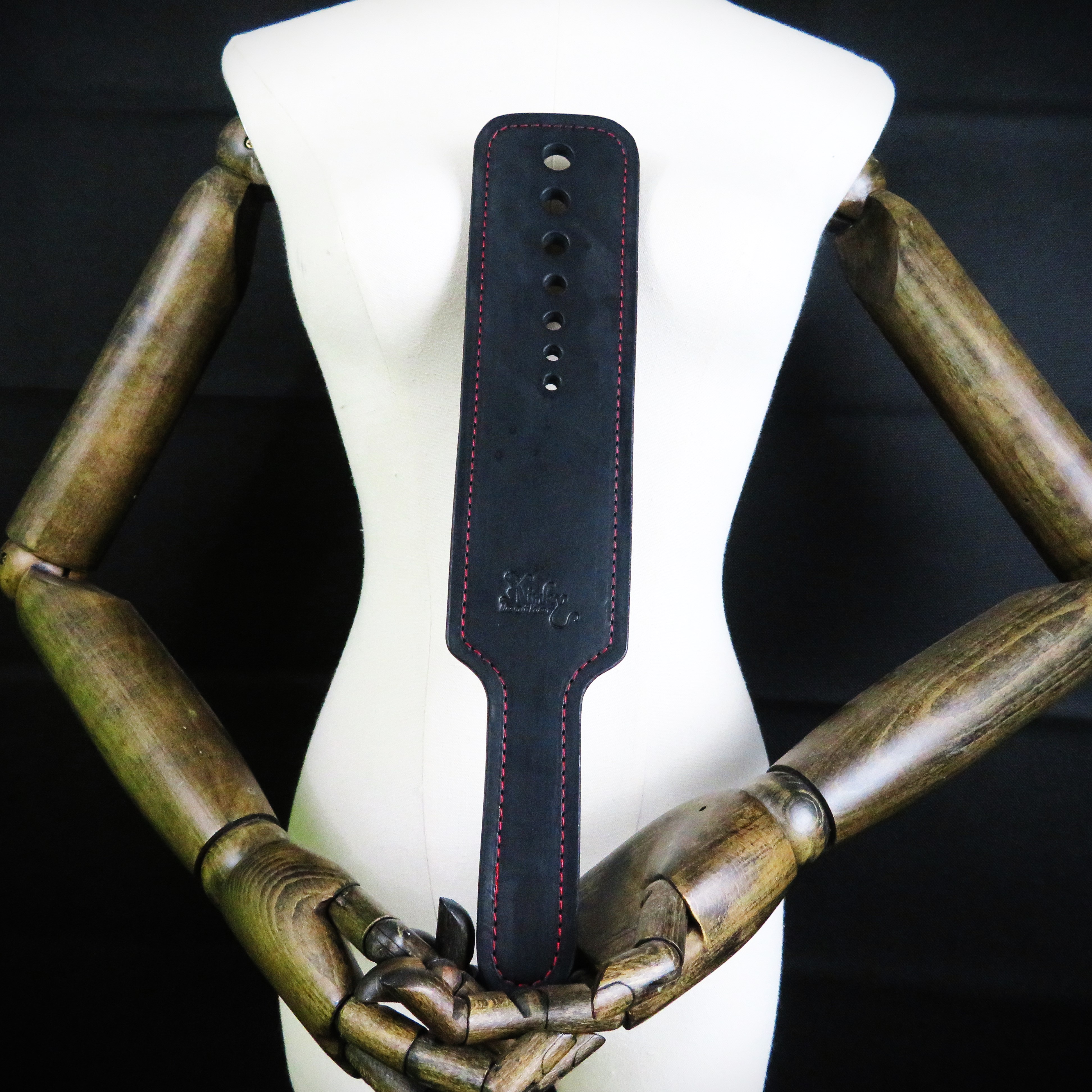 Handcrafted Black Leather Spanking Paddle with Bold Red Stitching