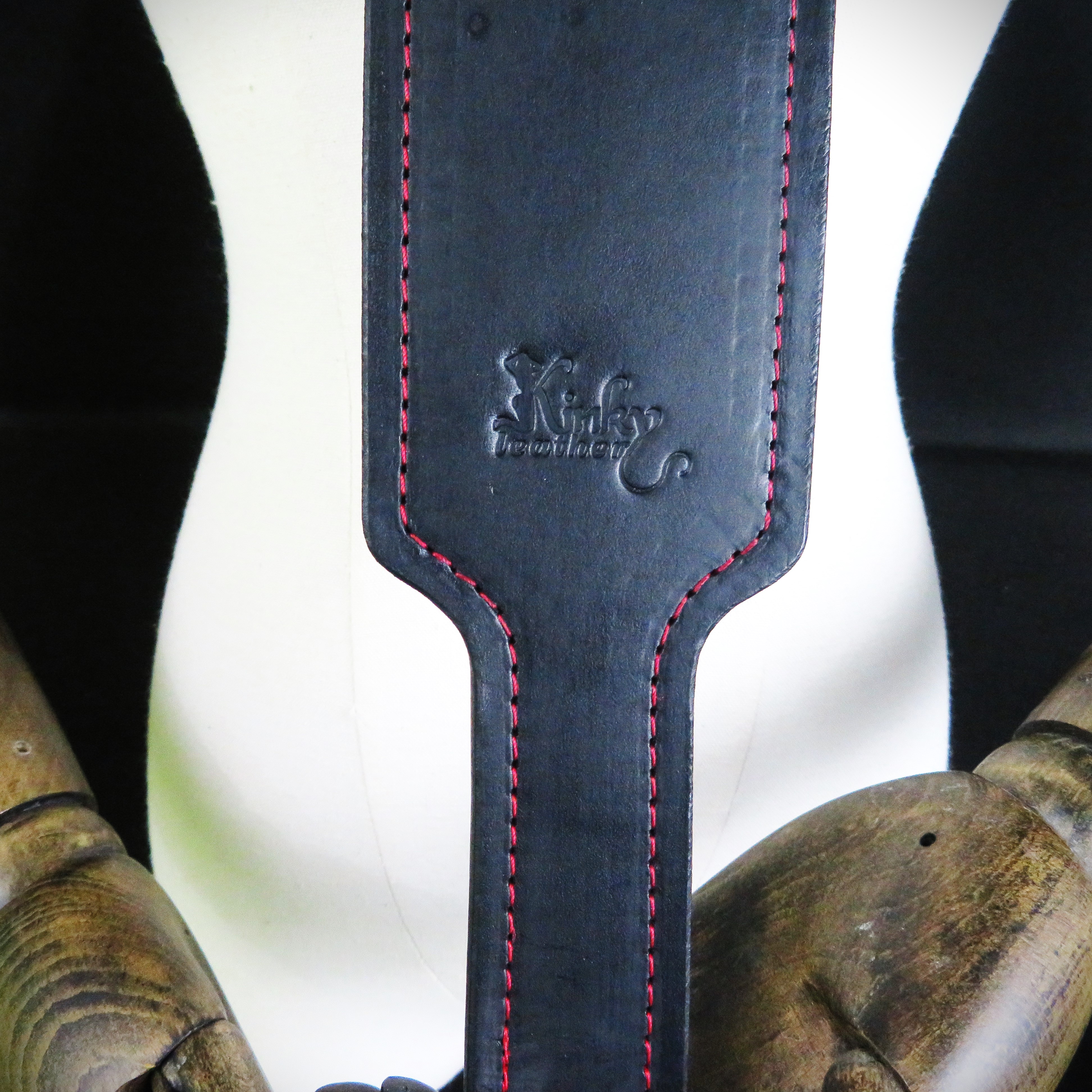 Handcrafted Black Leather Spanking Paddle with Bold Red Stitching
