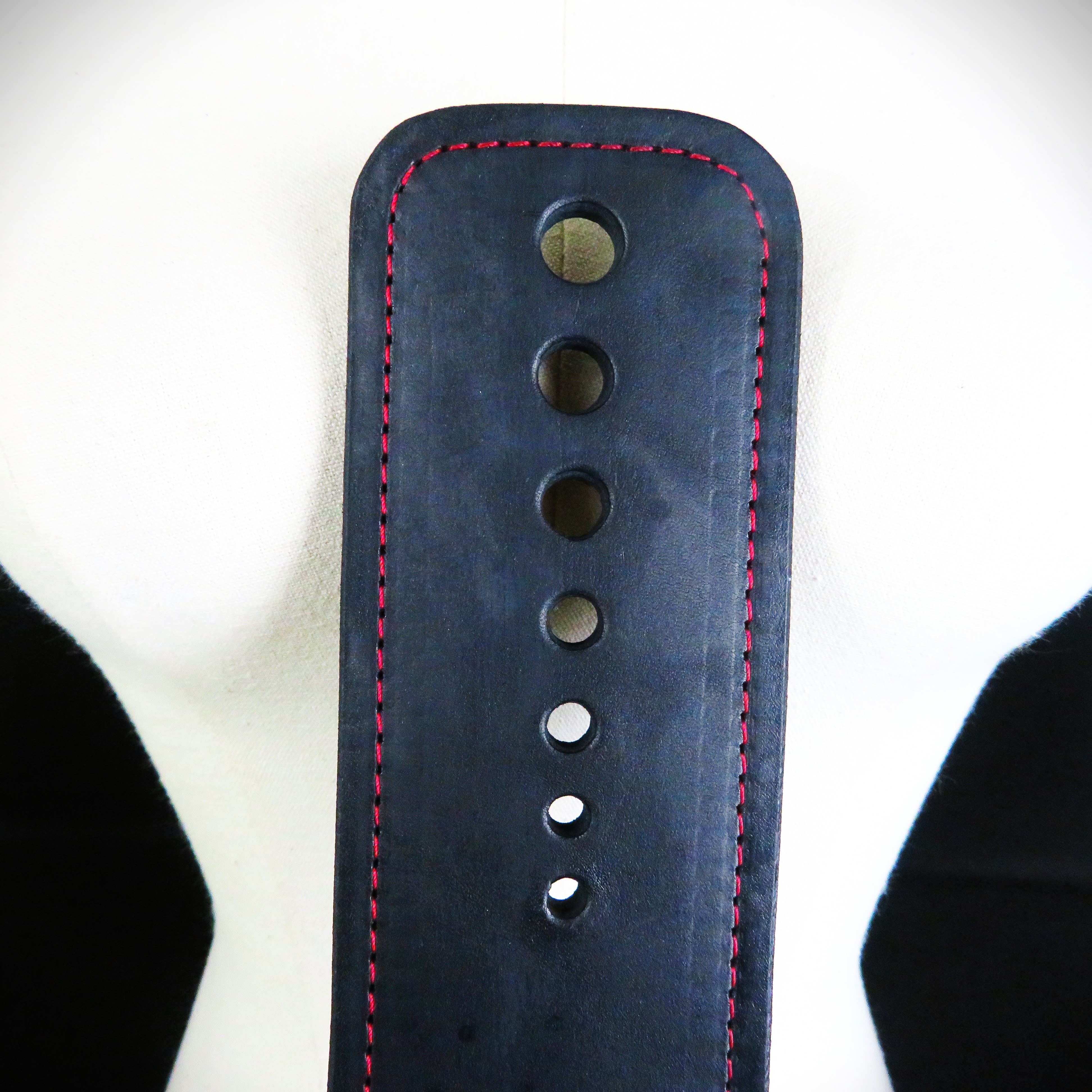 Handcrafted Black Leather Spanking Paddle with Bold Red Stitching