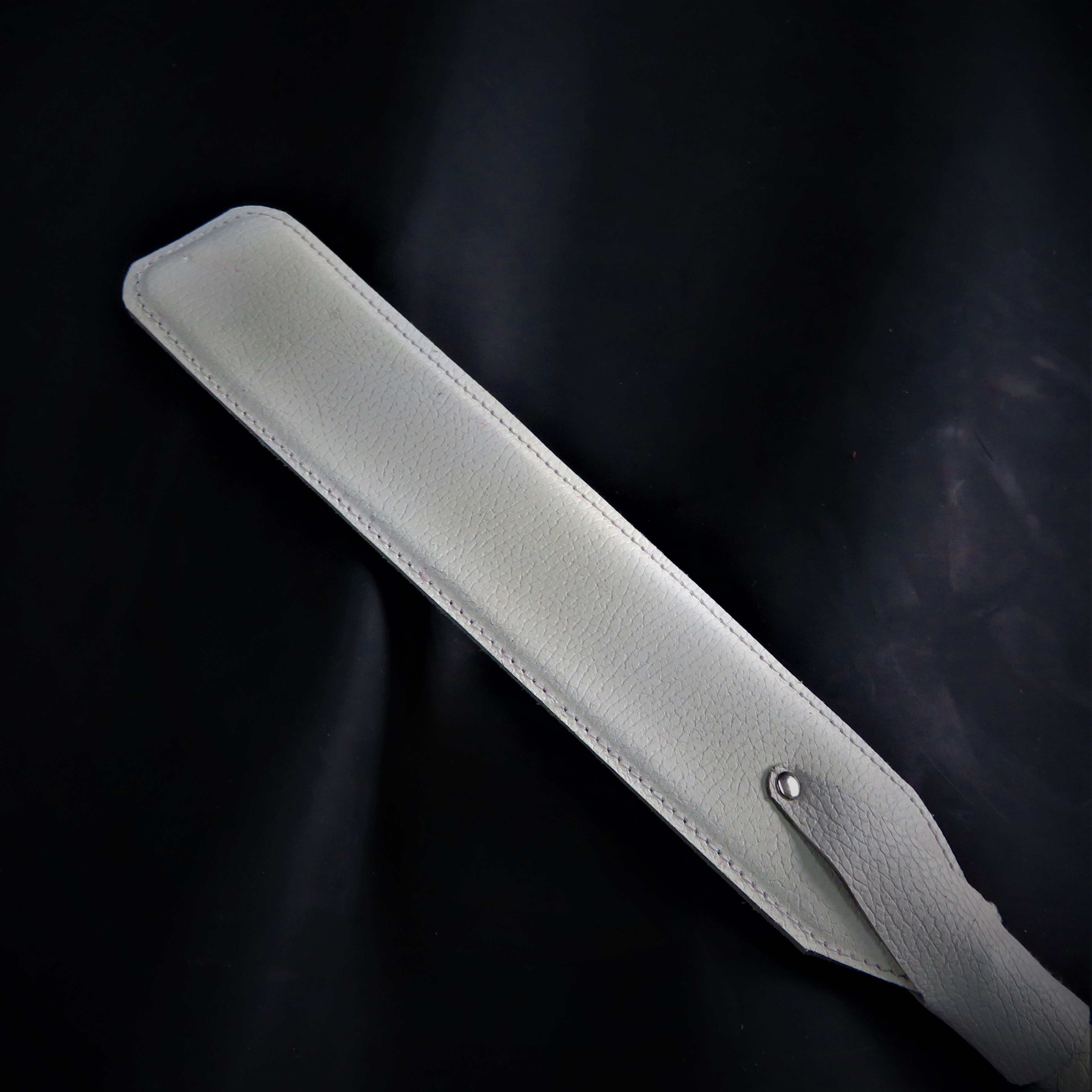 White Leather Spanking Paddle – Stylish & Sturdy Impact Toy