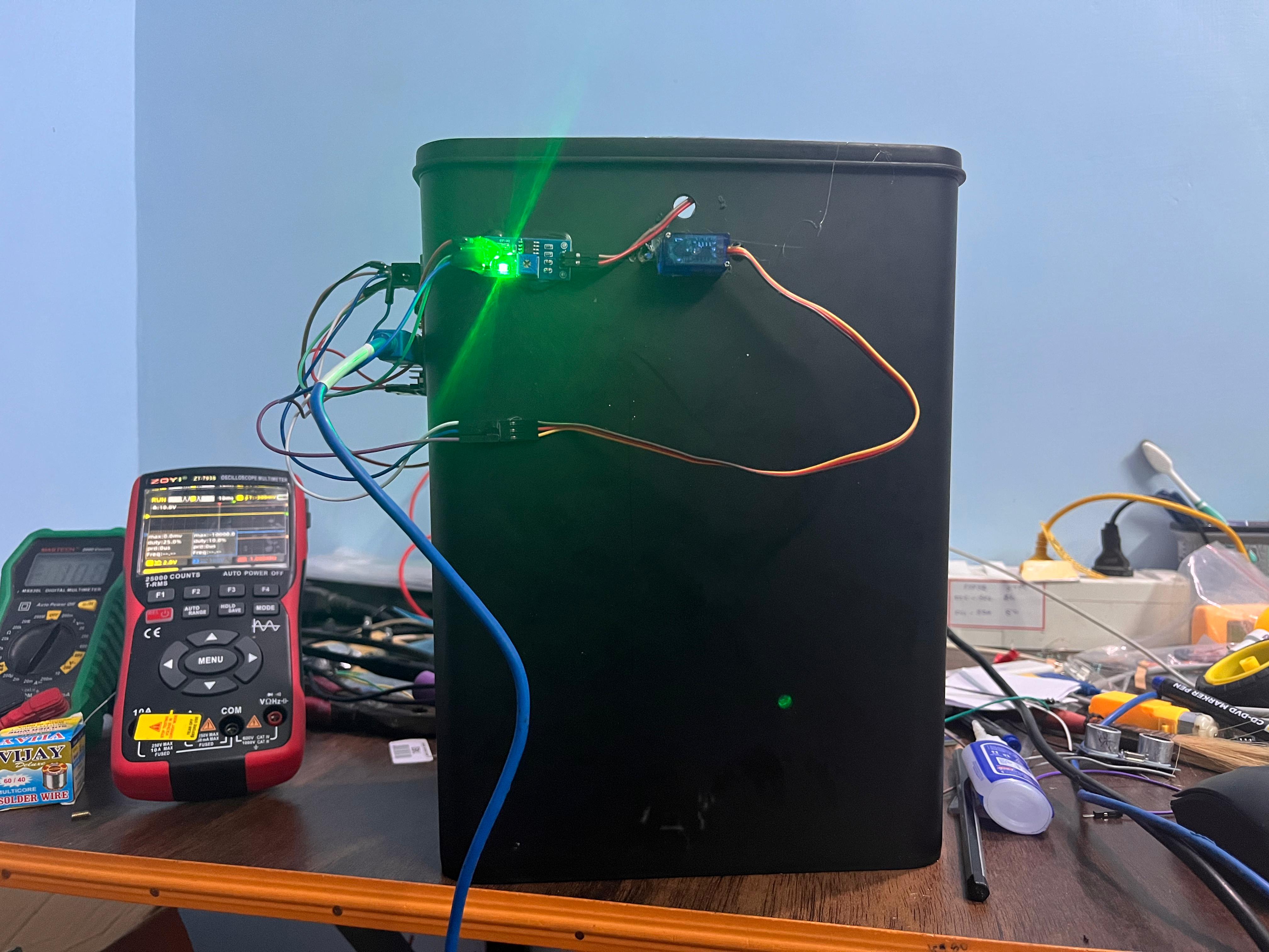 Smart Dustbin System Using IR and Wet Sensors with Servo Motor Control