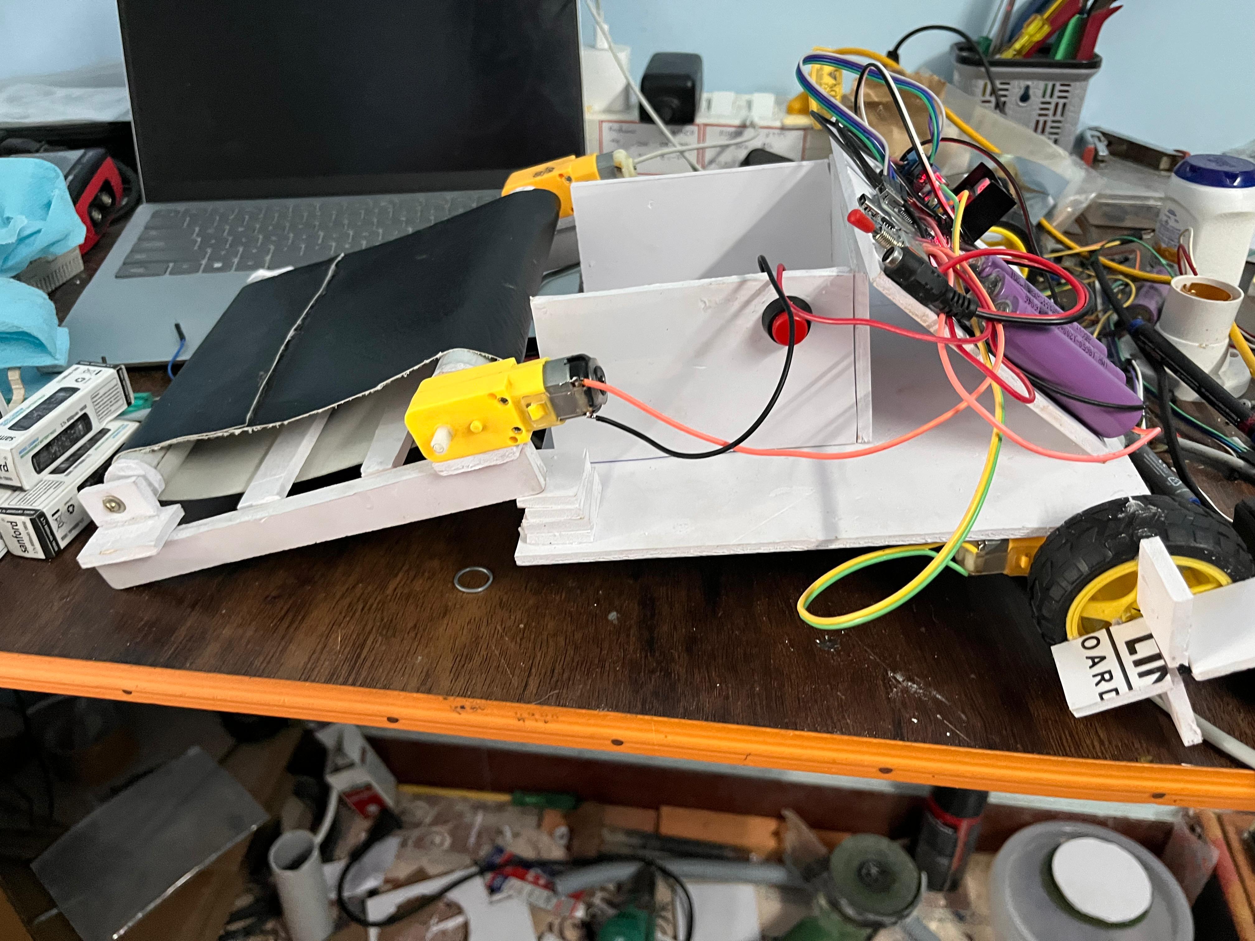 Autonomous River Cleaning Robot Using Conveyor Mechanism