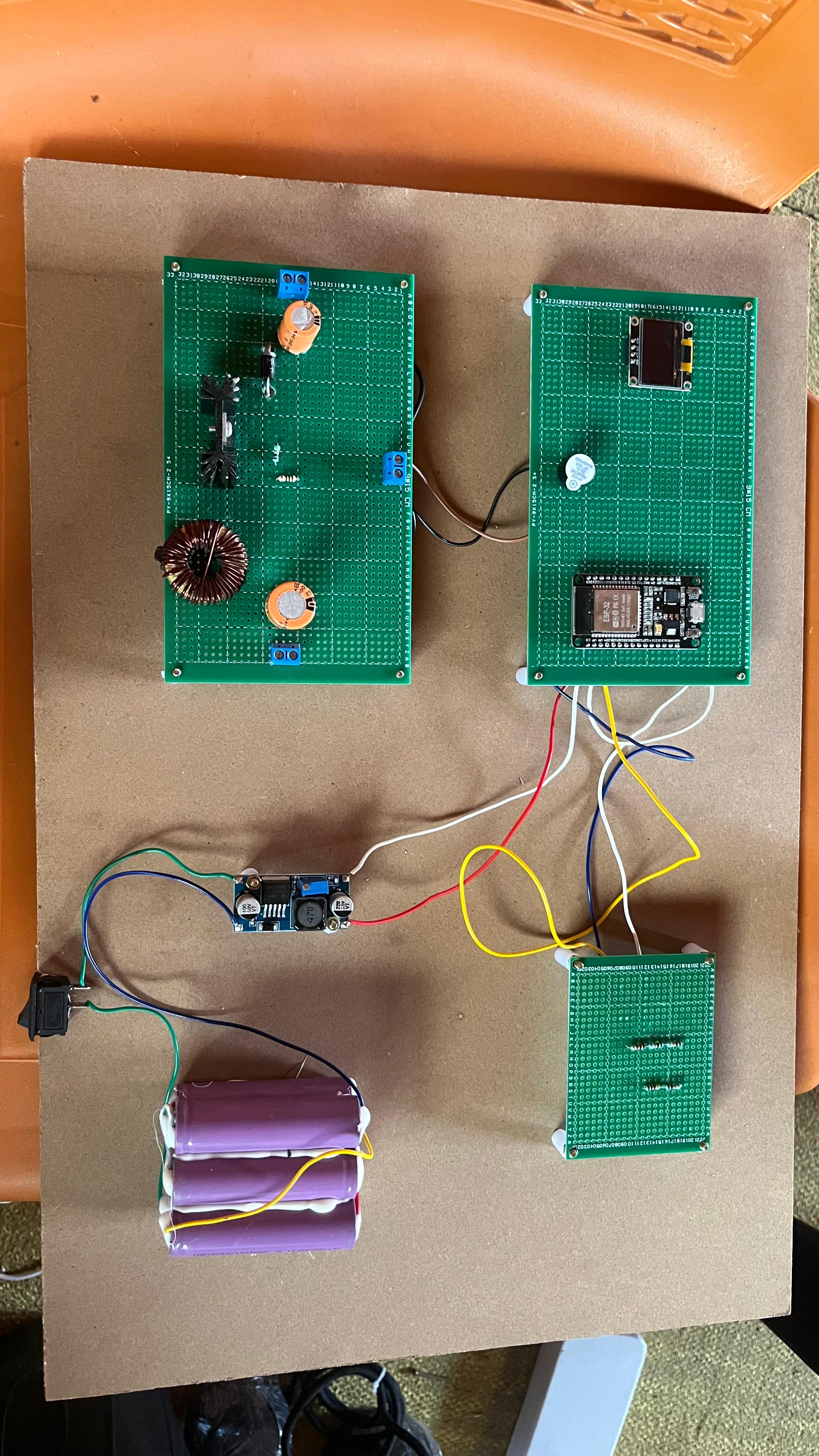 Design and Implementation of an ESP32-Based Closed-Loop DC-DC Power Management System with OLED Monitoring and Audible Fault Alert for 24V Battery Applications