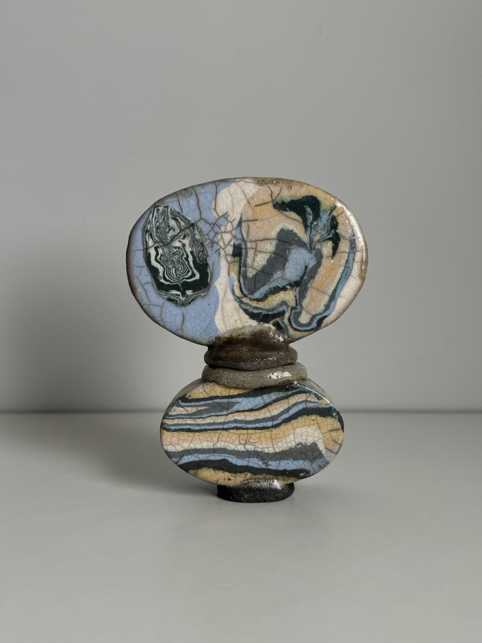 Ceramic perfume bottle with a crackle effect