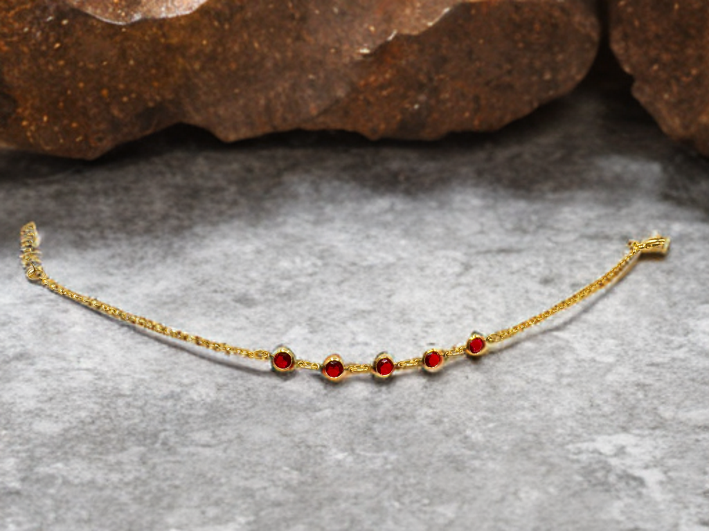 Gold Bracelet with Red Stones