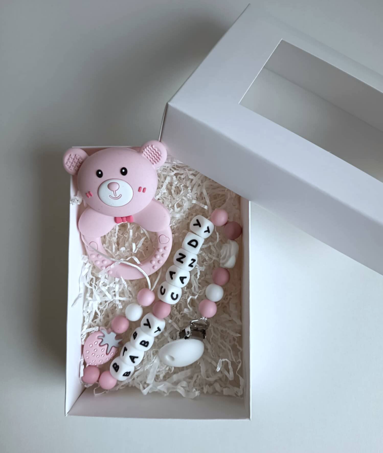 2 in 1 kramtukas/barškutis su laikikliu