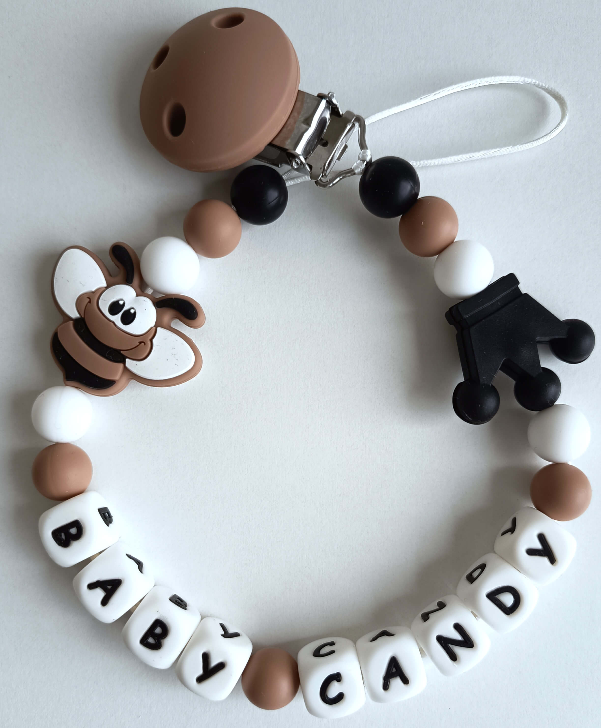 Vardinis čiulptuko laikiklis