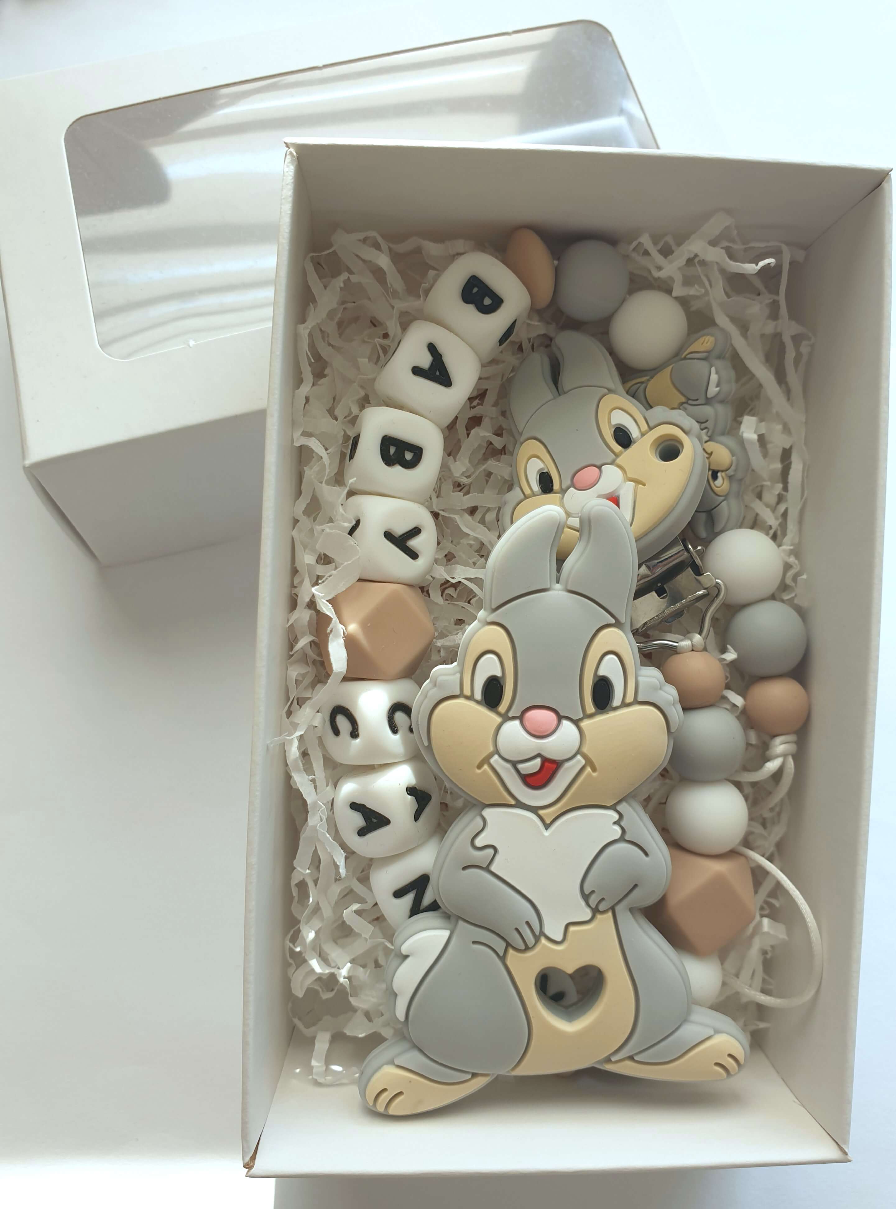 Čiulptuko laikiklis ir kramtukas "Zuikiai"