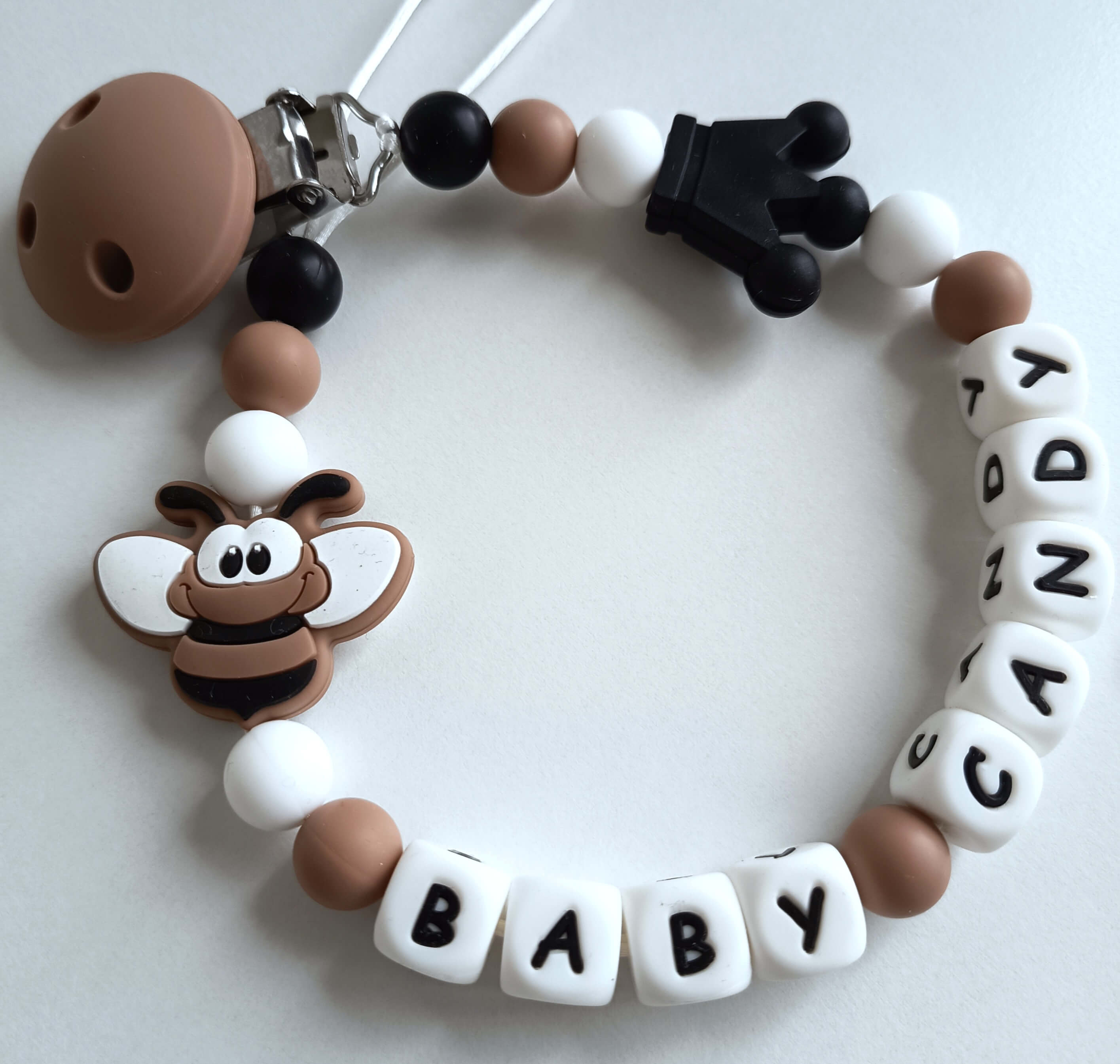 Vardinis čiulptuko laikiklis