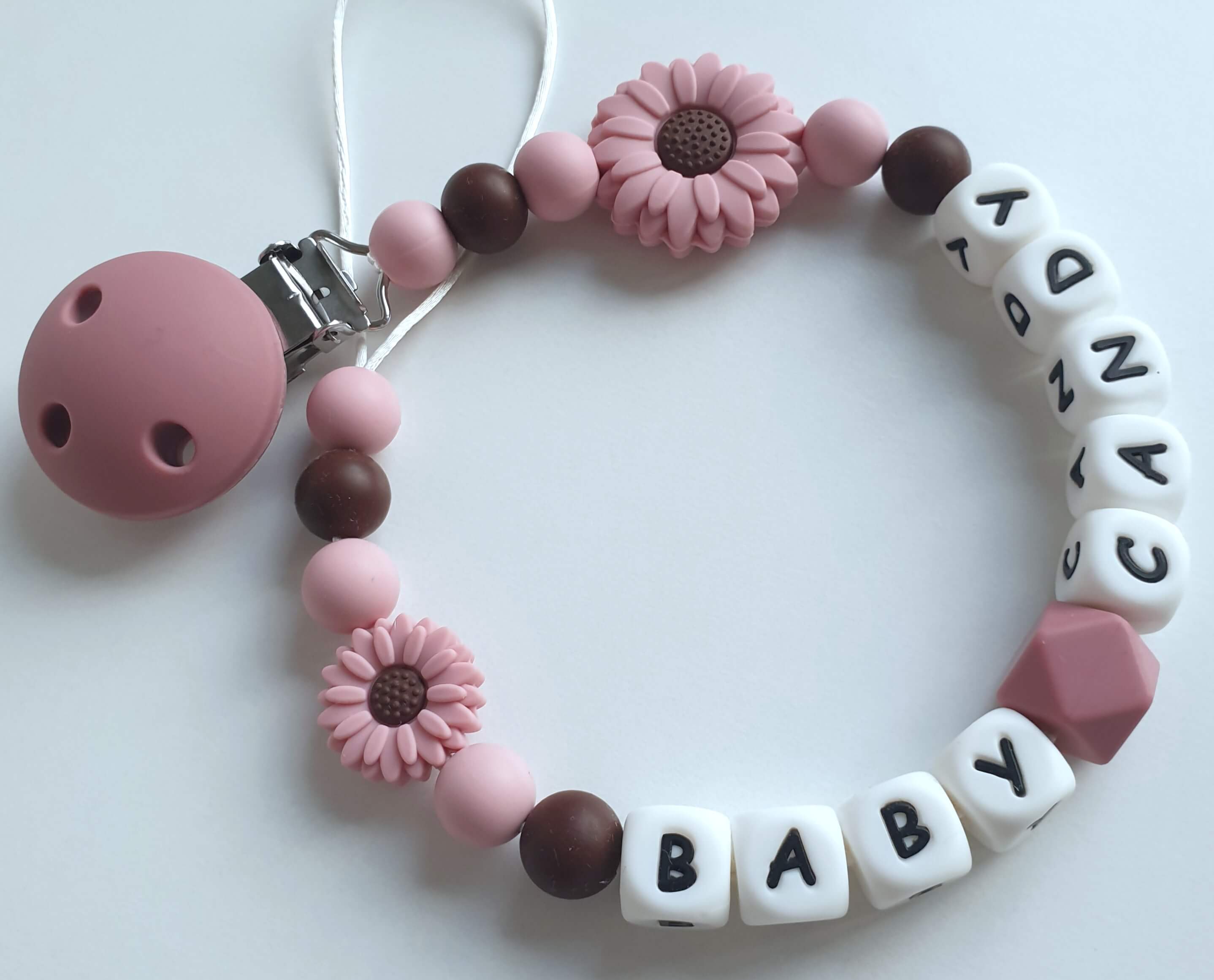 Vardinis čiulptuko laikiklis