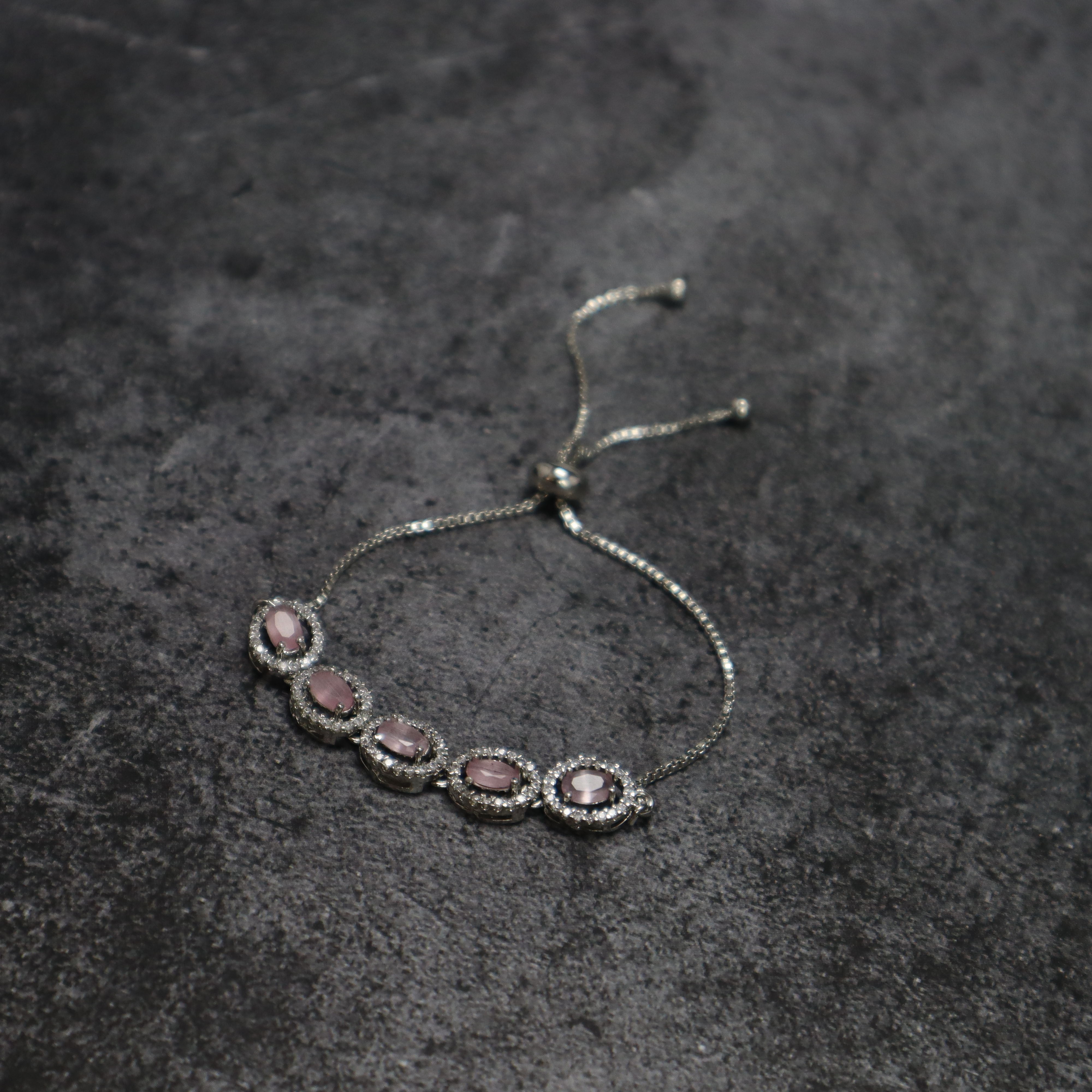 Keerthii Kalaa Pastel Pink Oval AD Stone Bracelet for Women & Girls - Sparkling Silver Chain Bracelet, Adjustable