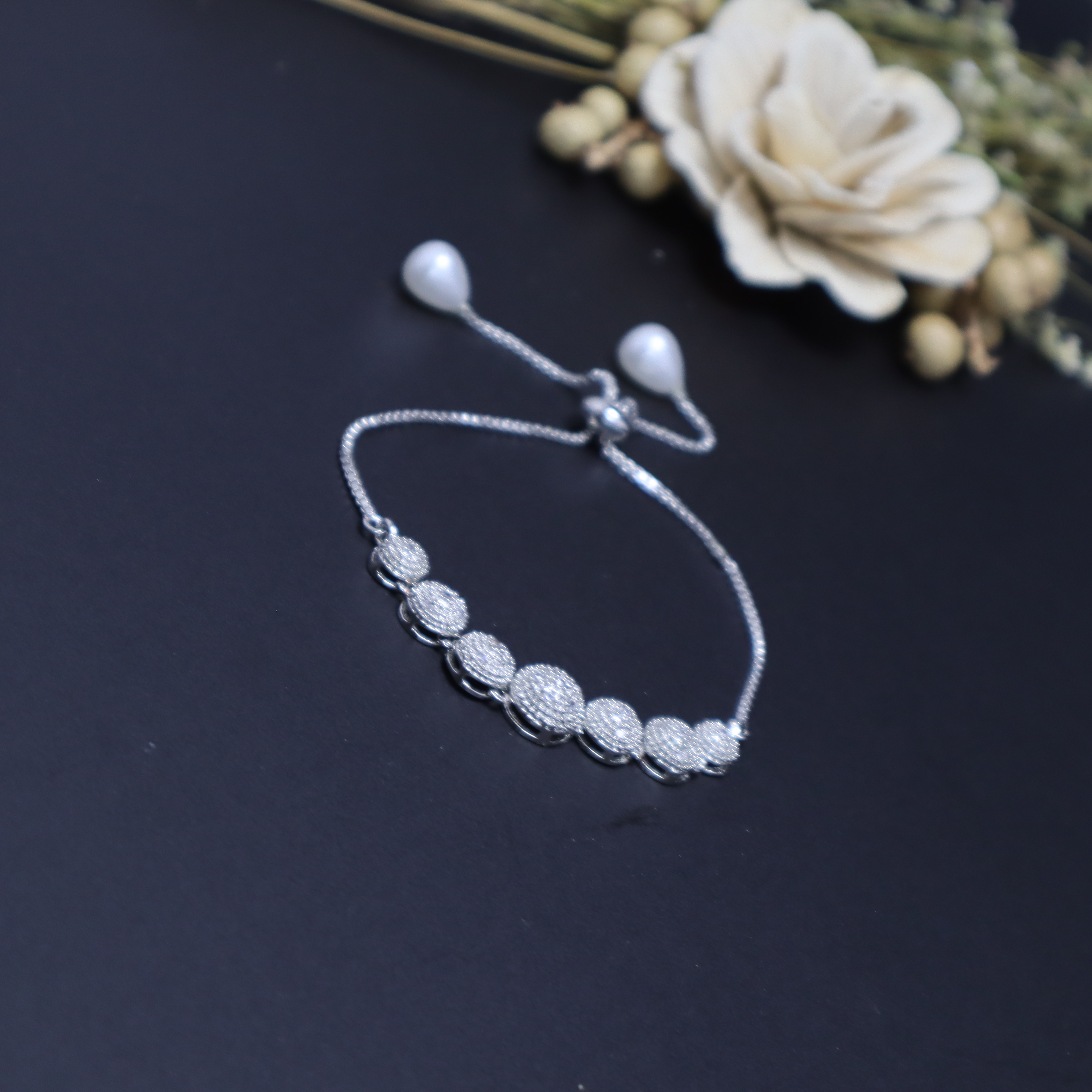 Keerthii Kalaa Sparkling Pave Ball Bracelet for Girls - Silver Adjustable Chain Bracelet with American Diamonds