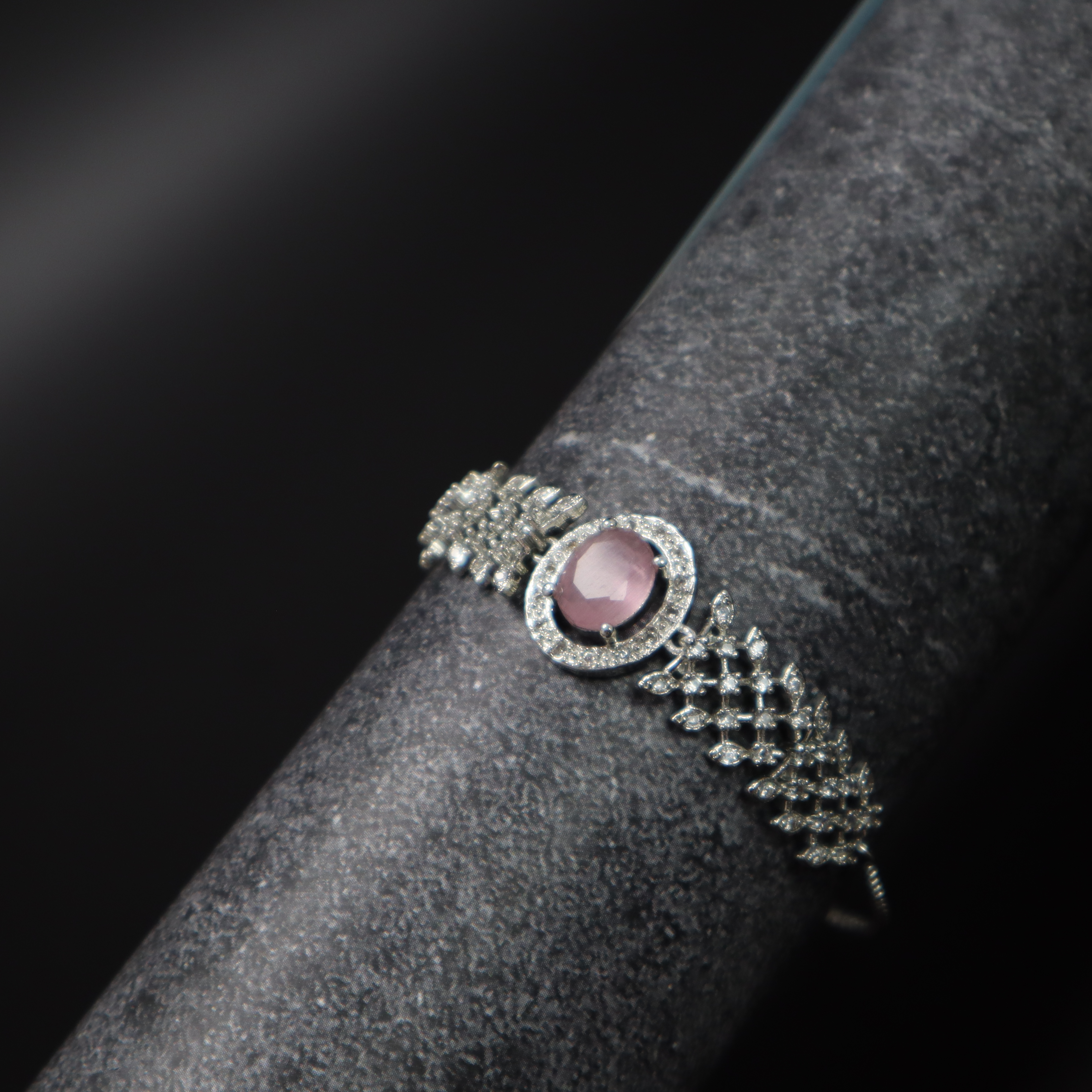 Keerthii Kalaa Pastel Pink Center Stone AD Bracelet for Women & Girls - Sparkling Silver Adjustable Chain